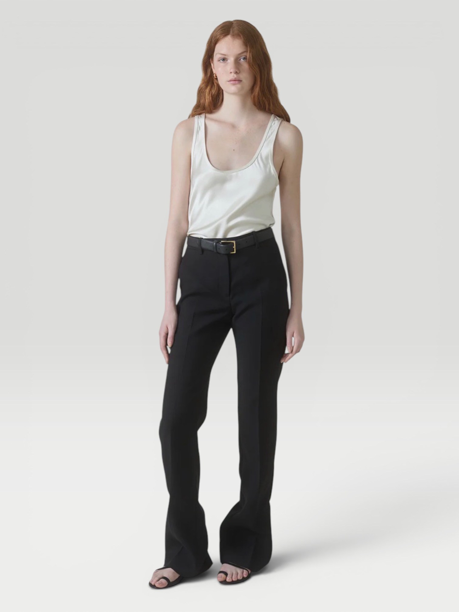 Heirlome Adau Top in ivory, worn with Khaite Walter Cotton and Silk-Blend Flared Pants. Styled by Sharon Lombardo for FDV Concierge.