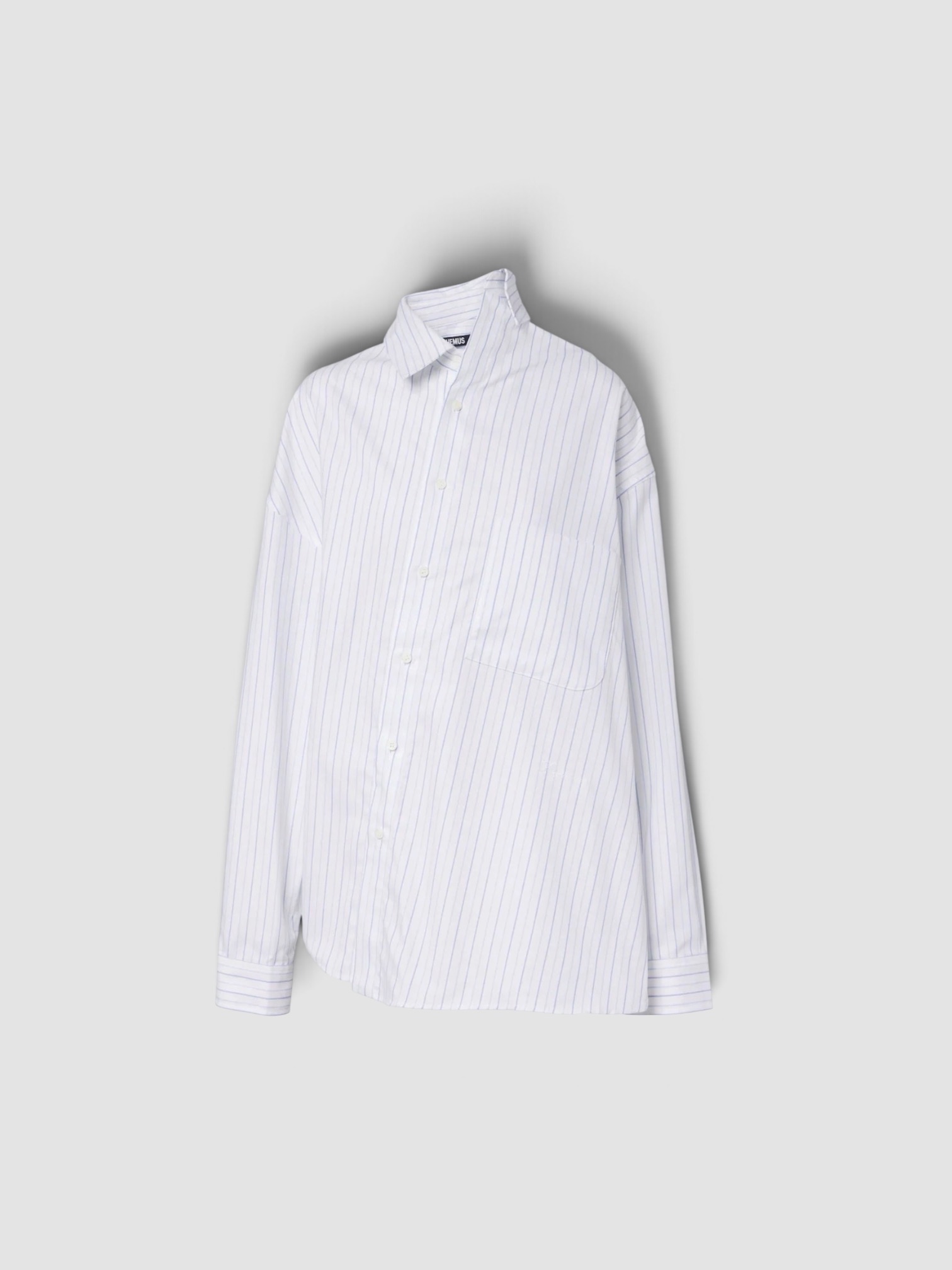 Jacquemus Cuadro Asymmetric Striped Cotton Shirt in white, worn with R13 Cuffed X-Boyfriend Jeans, Bottega Veneta Drop Squared Sunglasses. Styled by Sharon Lombardo for FDV Concierge.