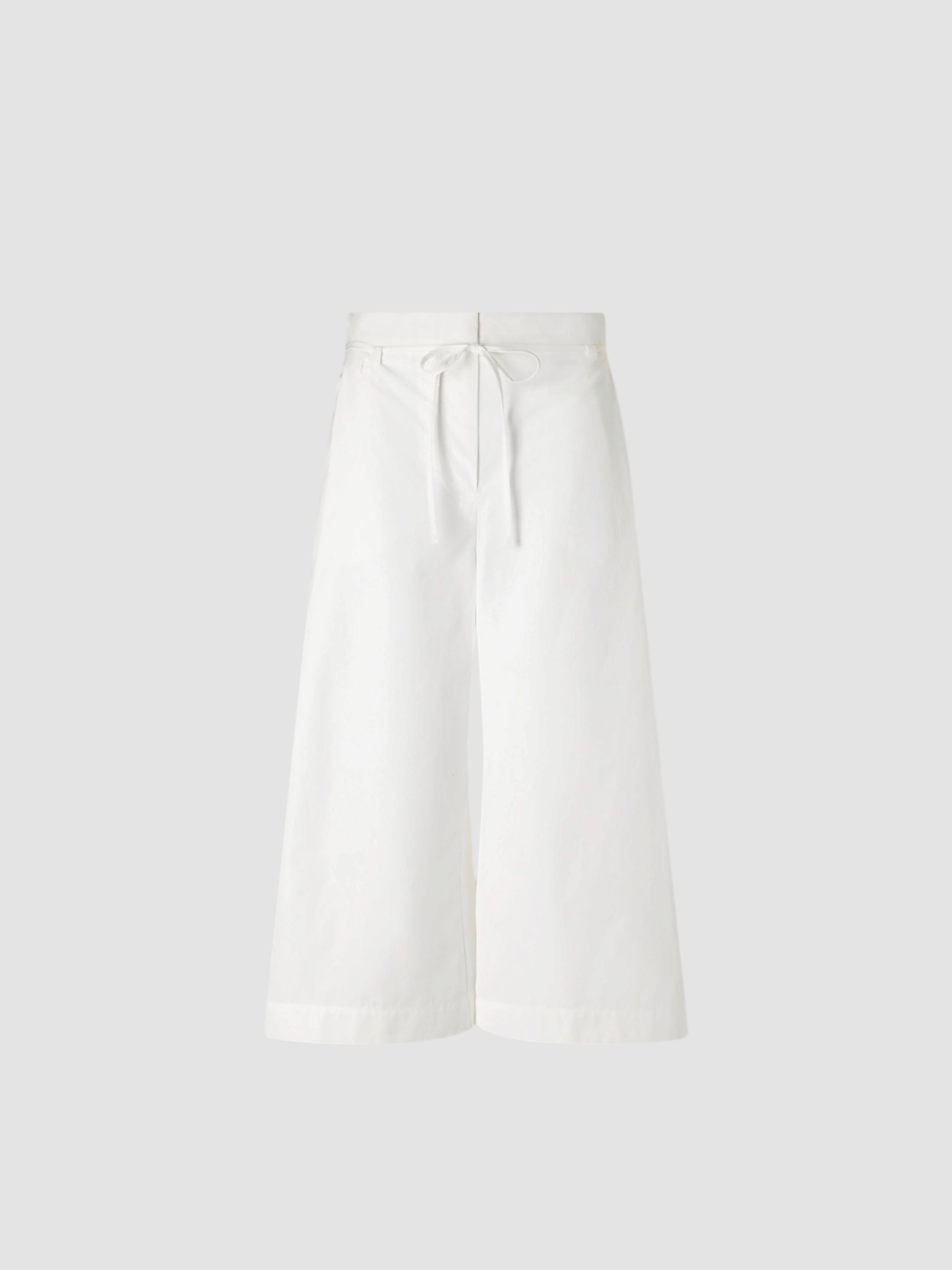 Jacquemus Le Marin High Rise Shorts in white, worn with Jacquemus Striped Shirt, Bottega Veneta Small Onda Clutch, Neous Arneb 65 Sandals. Styled by Sharon Lombardo for FDV Concierge.