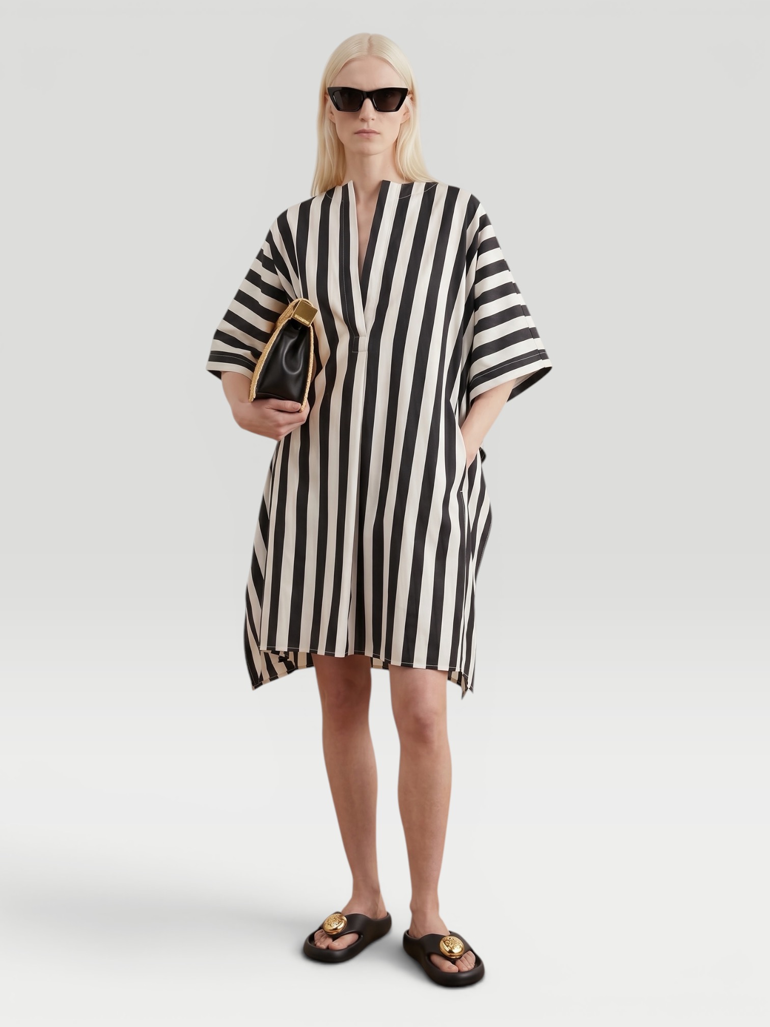 Jacquemus Moisson Oversized Striped Midi Dress, worn with Loewe Leather-Trimmed Raffia Tote. Styled by Sharon Lombardo for FDV Concierge.