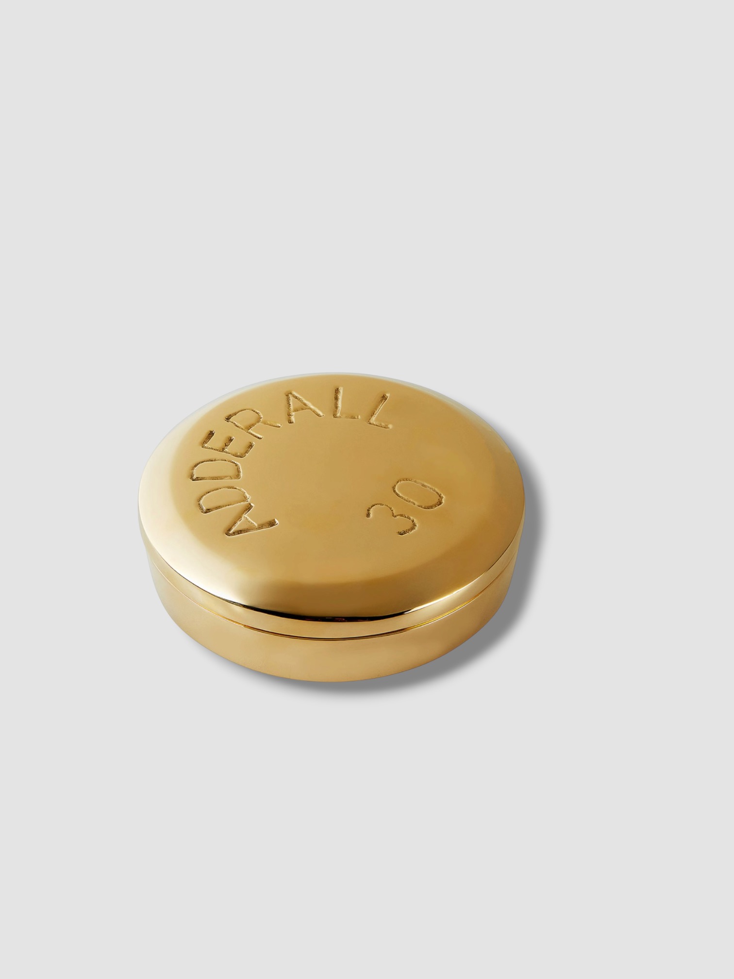 Jonathan Adler Adderall Brass Pill Box in polished brass.