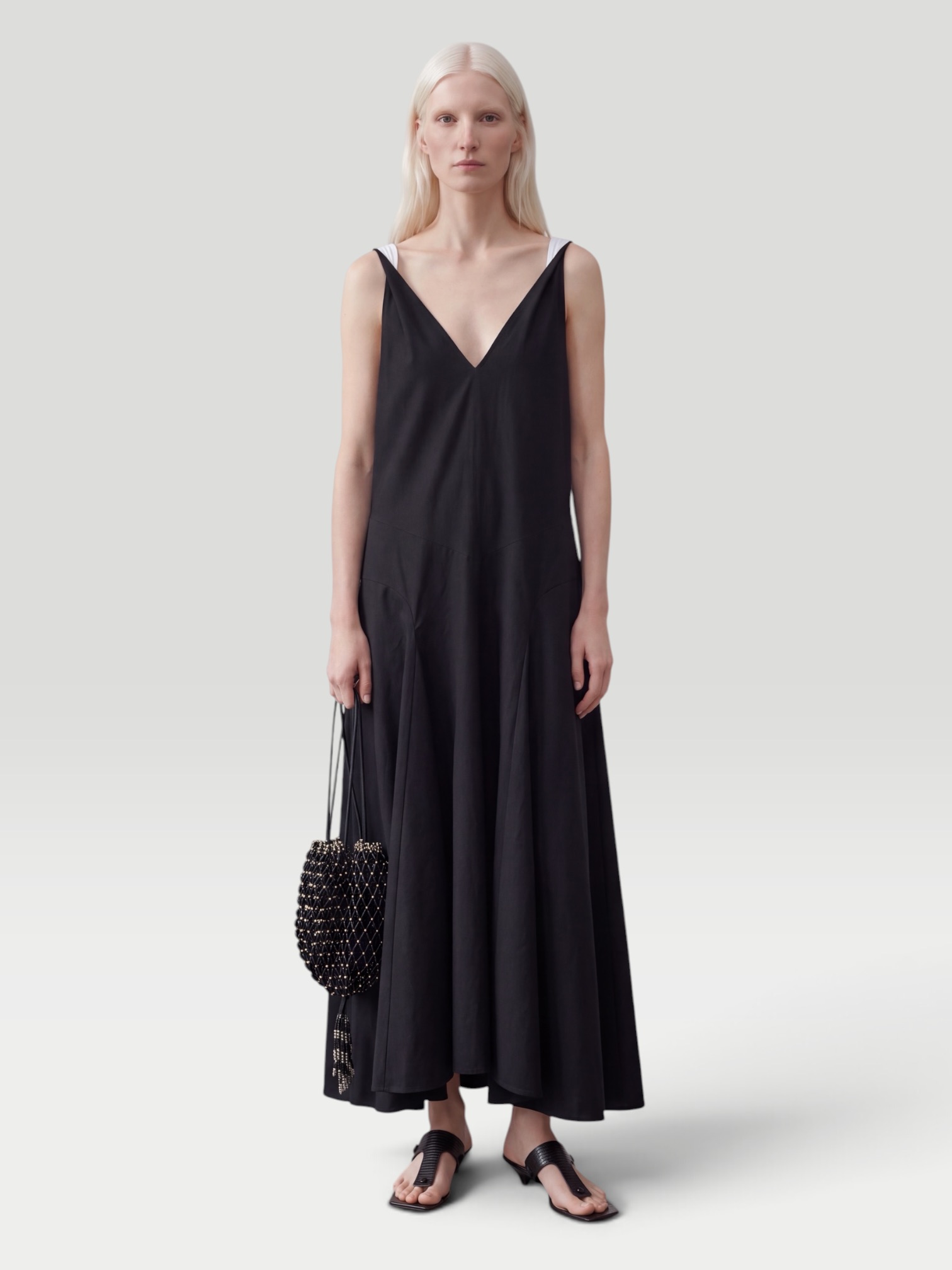 Kallmeyer Millie Gusset Dress in black, worn with Alaïa Flat Strappy Sandal. Styled by Sharon Lombardo for FDV Concierge.