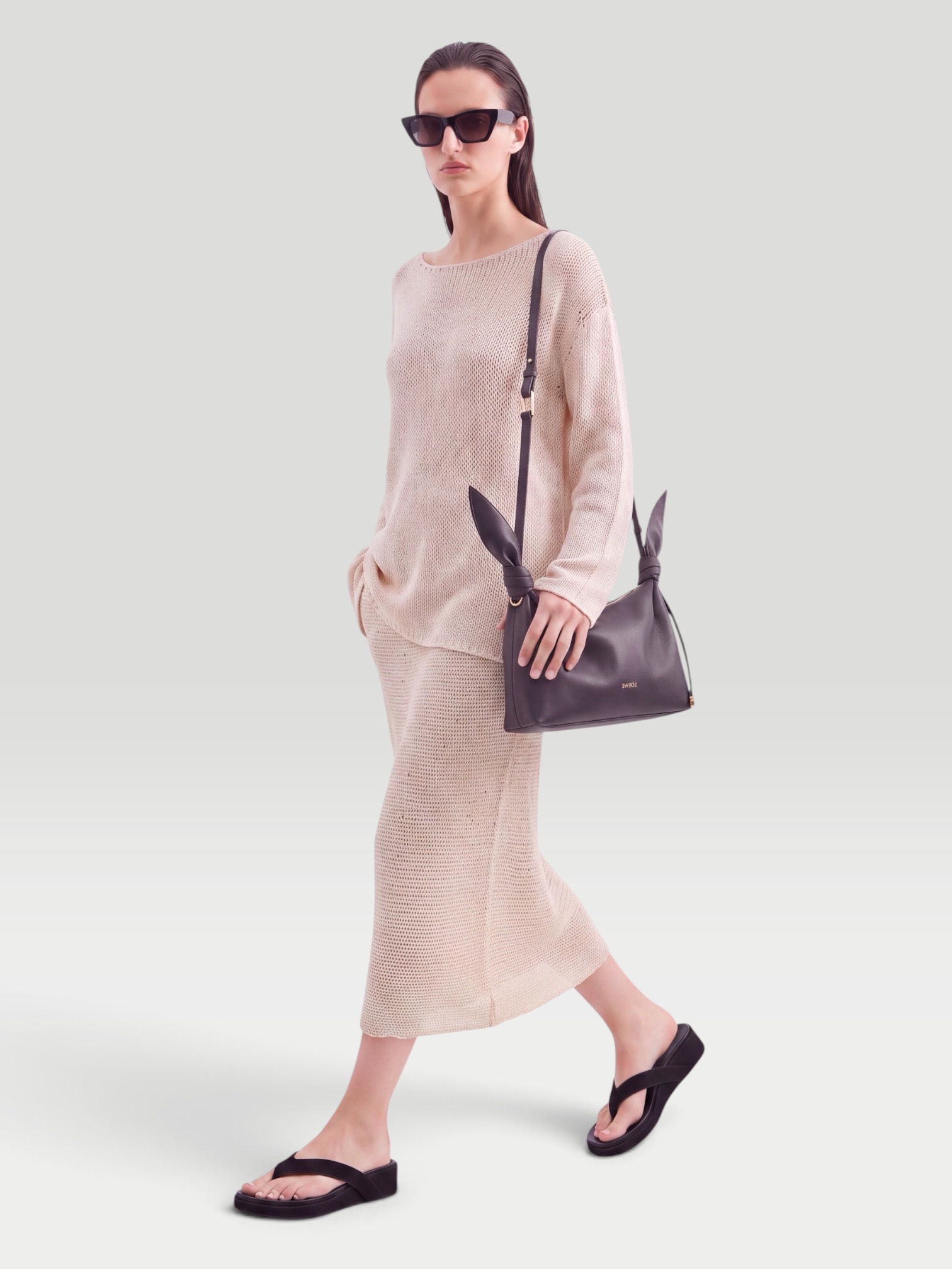 Khaite Inaya Crocheted Cotton and Silk-Blend Midi Skirt in ivory. Styled by Sharon Lombardo for FDV Concierge.