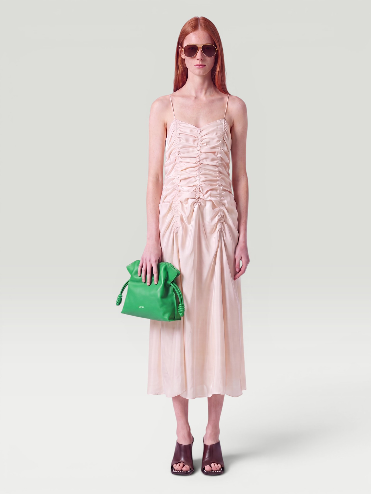 Khaite Raina Ruched Satin Maxi Dress in ivory glow. Styled by Sharon Lombardo for FDV Concierge.