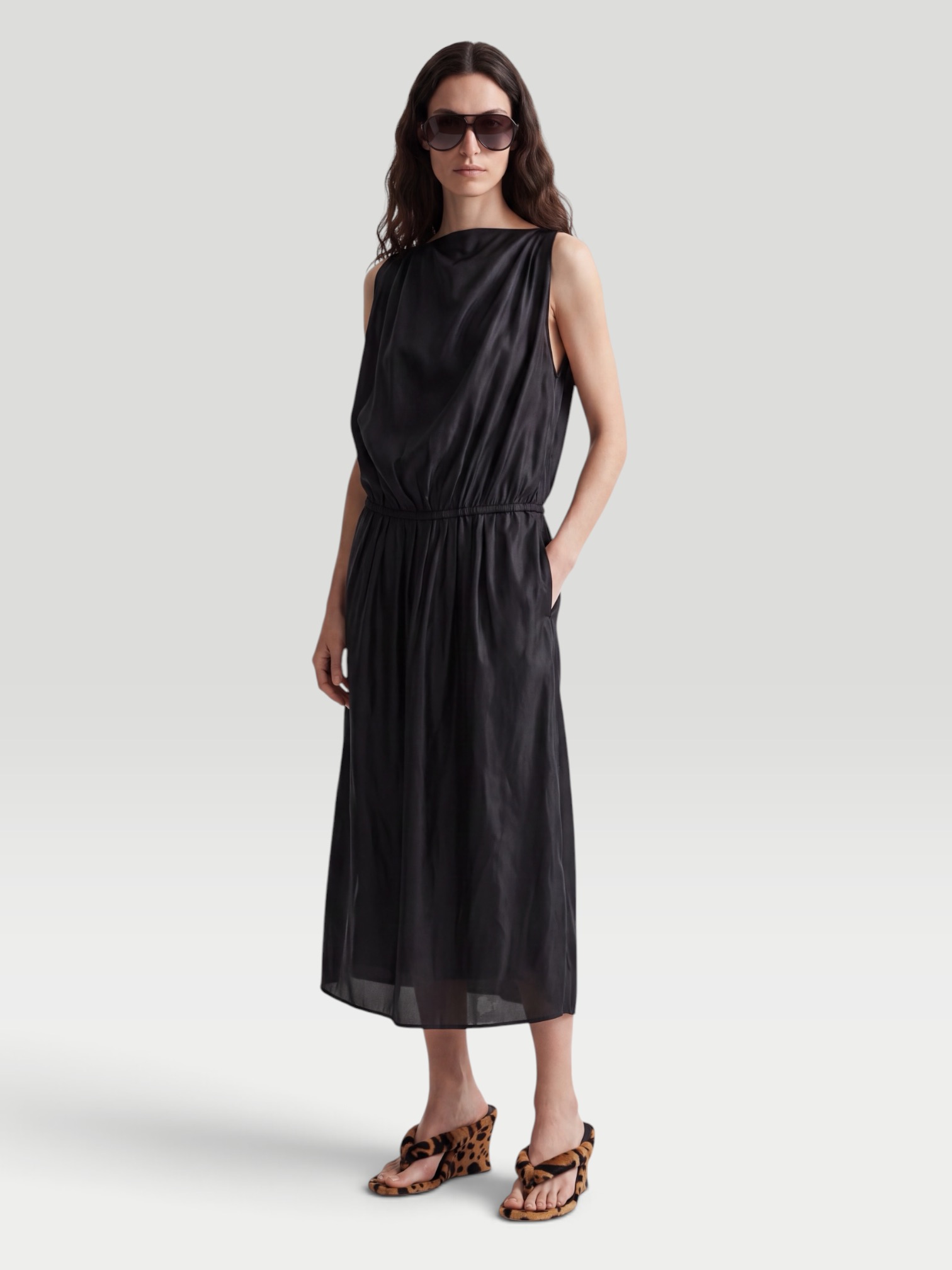Khaite Tia Satin-Twill Midi Dress in black. Styled by Sharon Lombardo for FDV Concierge.