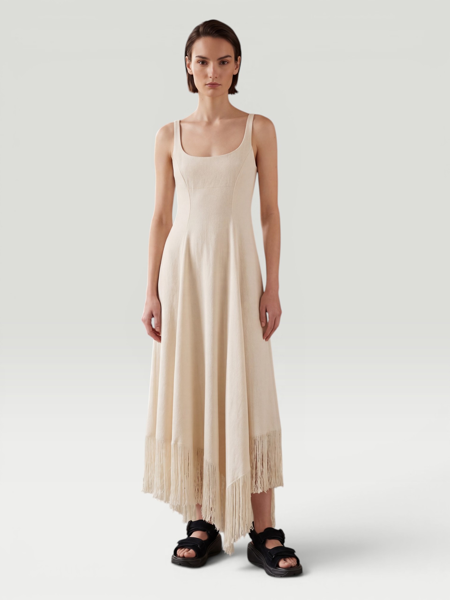 Khaite Vivian Fringed Crepe Maxi Dress in white. Styled by Sharon Lombardo for FDV Concierge.