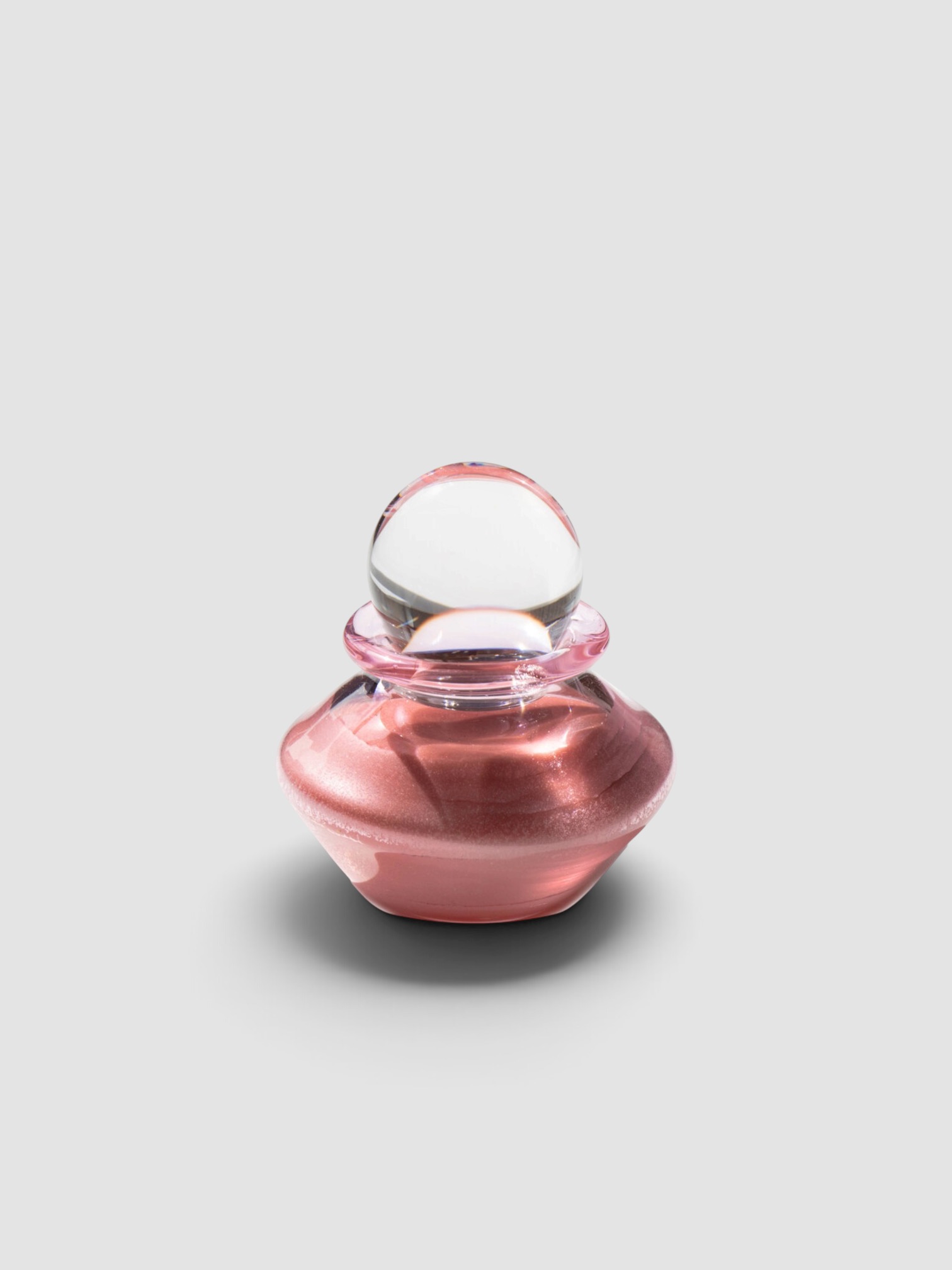 Kindred Black Exclusive La Isla Cosmica Glow Balm in shimmering rose pink.