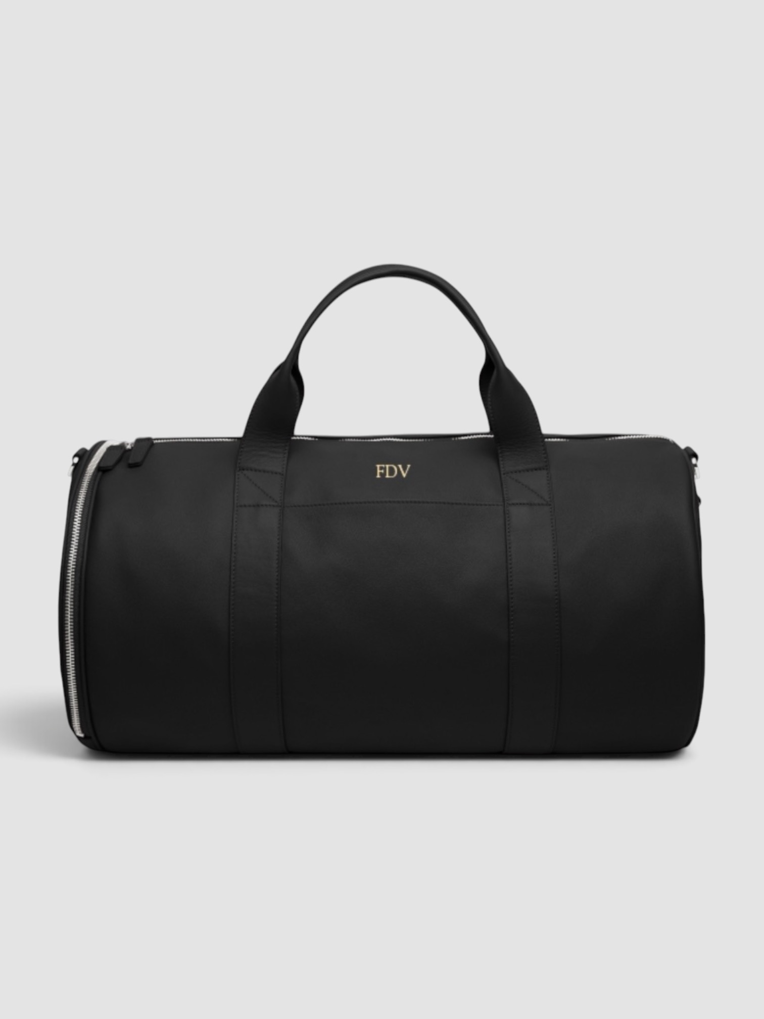 Leatherology Barrel Gym Bag in black, worn with St. Agni Soft Jersey Slim Scoop Tank, Venroy Fleece Track Pant, Kallmeyer Yasmin Tunic in Novelty Cotton Slub, Phoebe Philo Frizz Flip Flop, the journey. Styled by Sharon Lombardo for FDV Concierge.