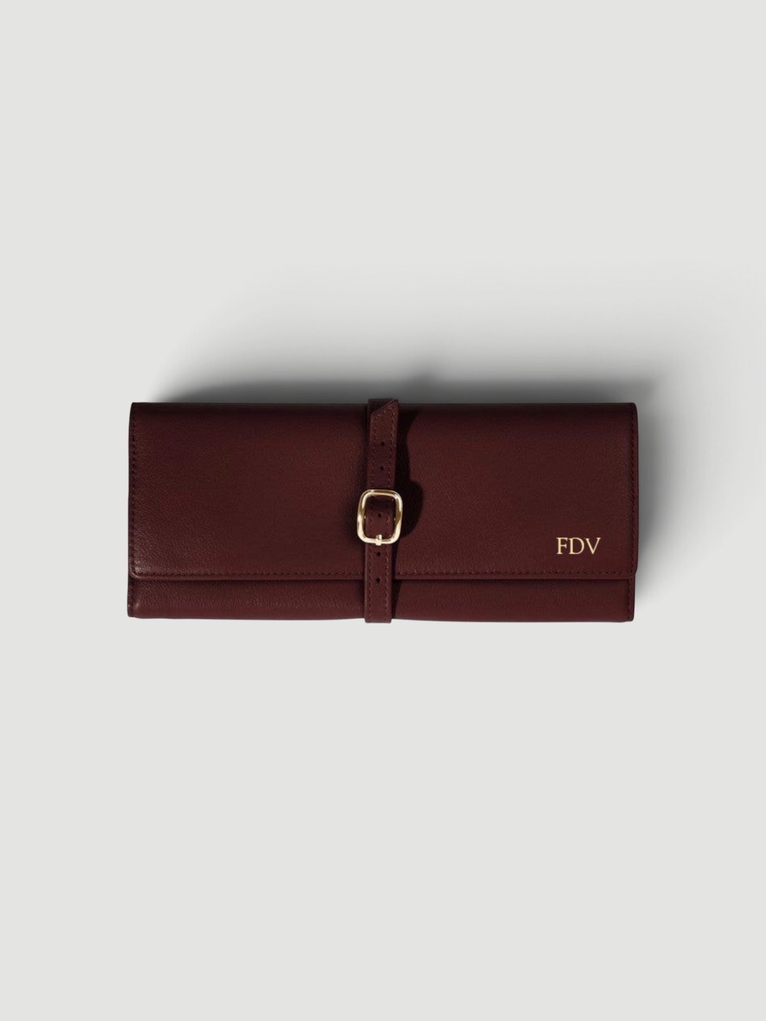 Leatherology Buckled Jewelry Roll in bordeaux.