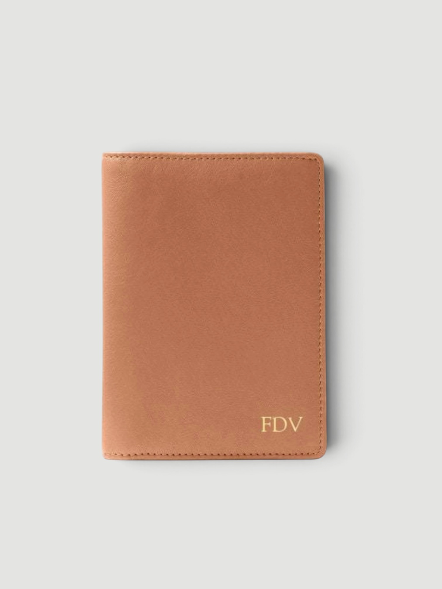 Leatherology Deluxe Passport Cover in saddle brown.