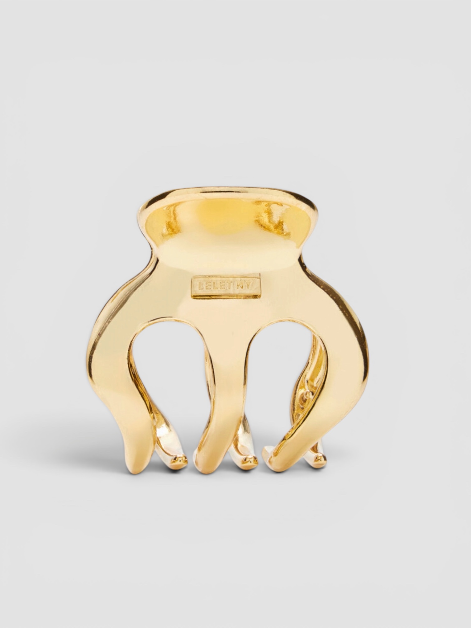 Lele Sadoughi Gold Metal Mini Claw Clip in gold.