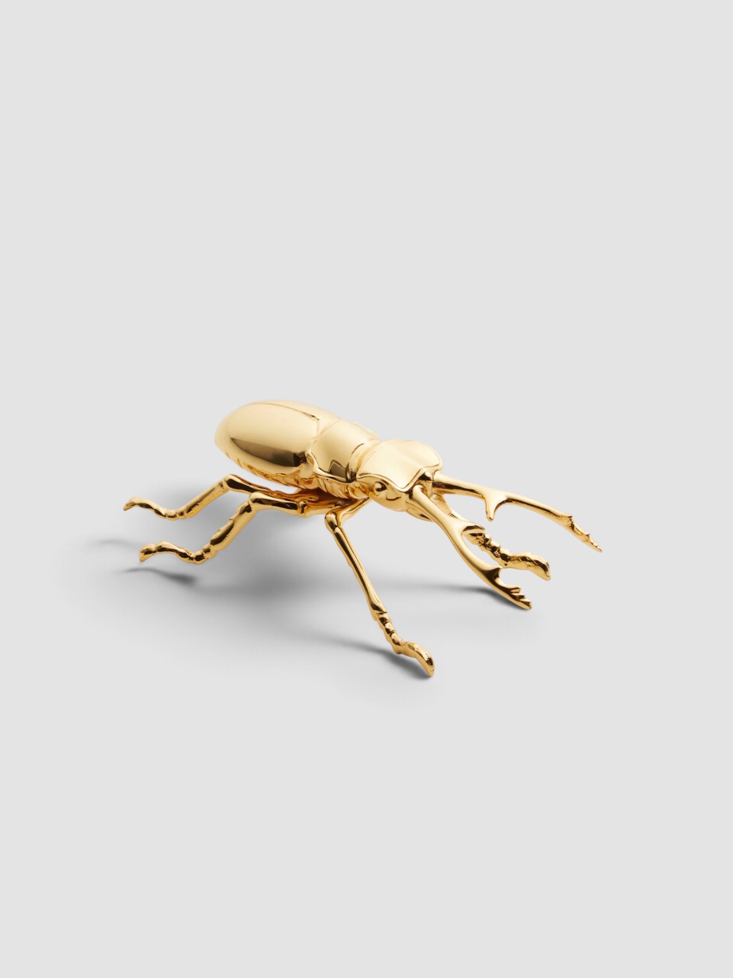 L'Objet Longhorn Bottle Opener in gold.