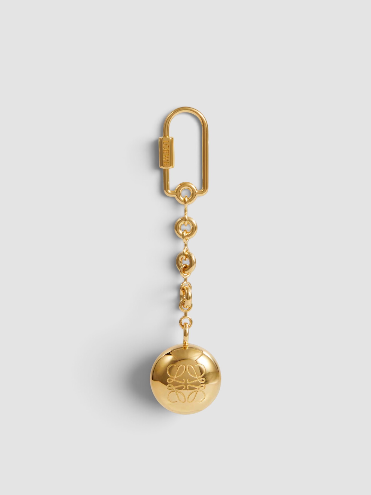 Loewe Anagram Pebble Keychain in gold.