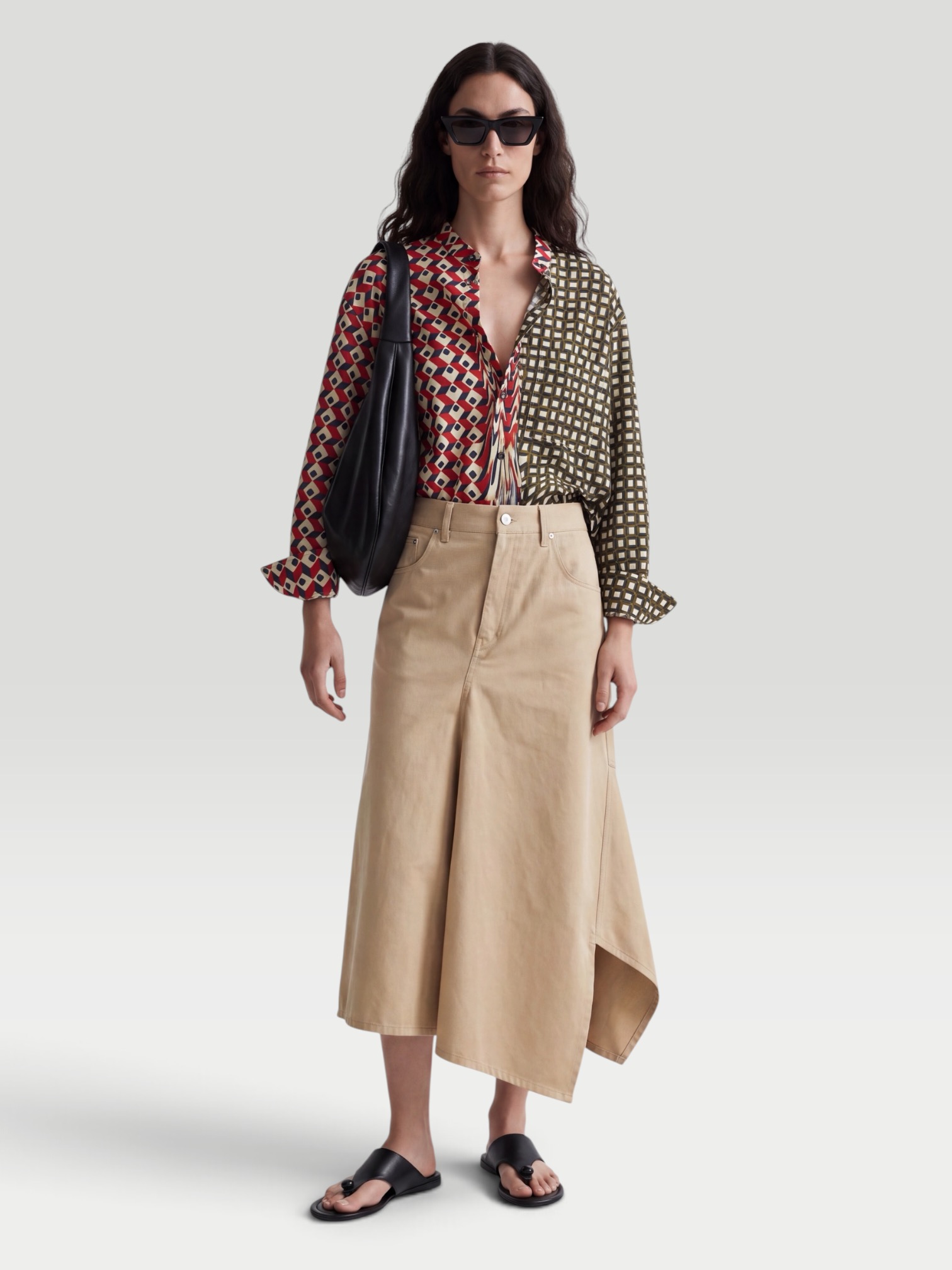 Loewe Asymmetrical Cotton-Gabardine Midi Skirt in beige. Styled by Sharon Lombardo for FDV Concierge.