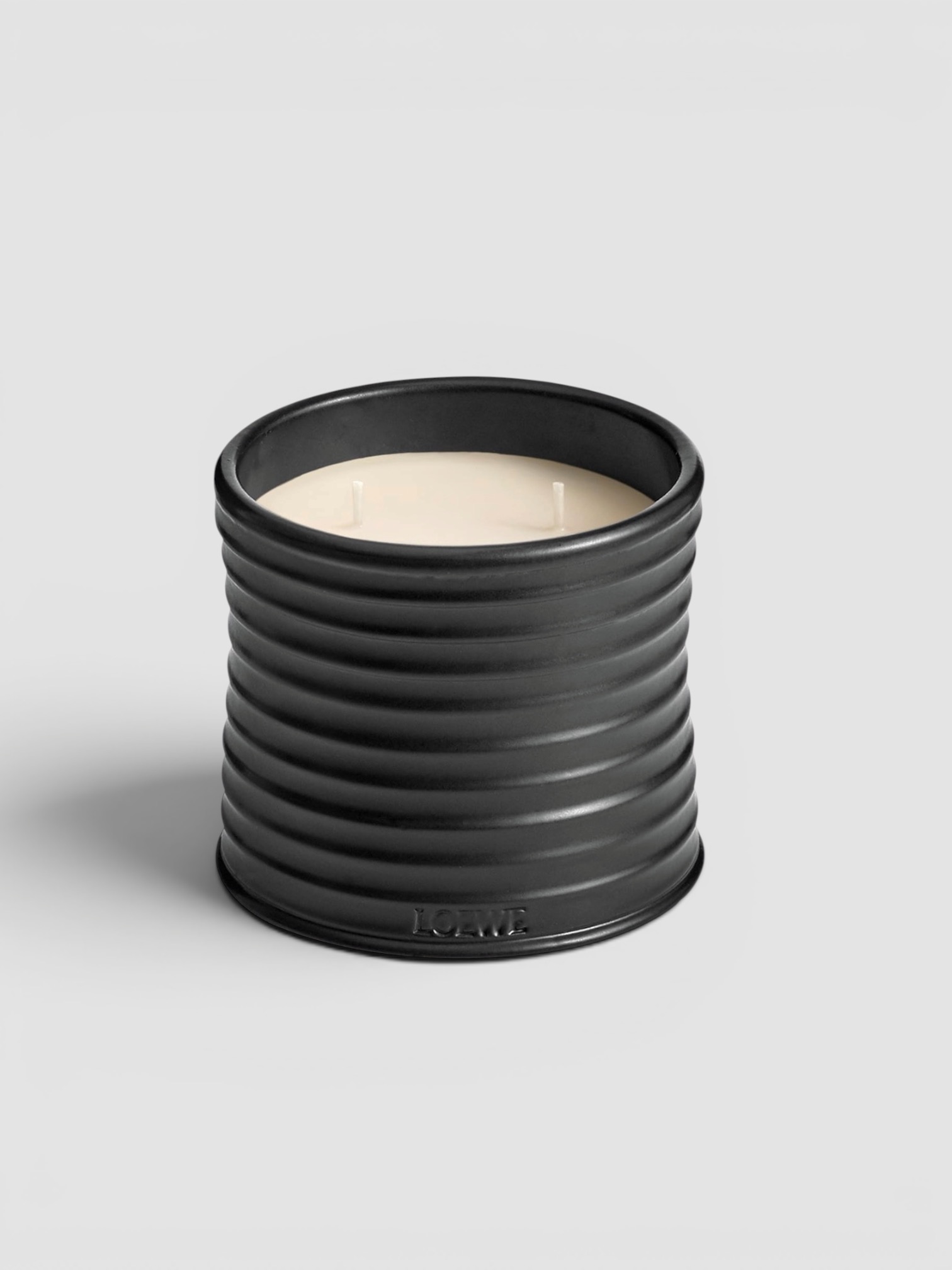 Loewe Palo Santo Candle in tan.