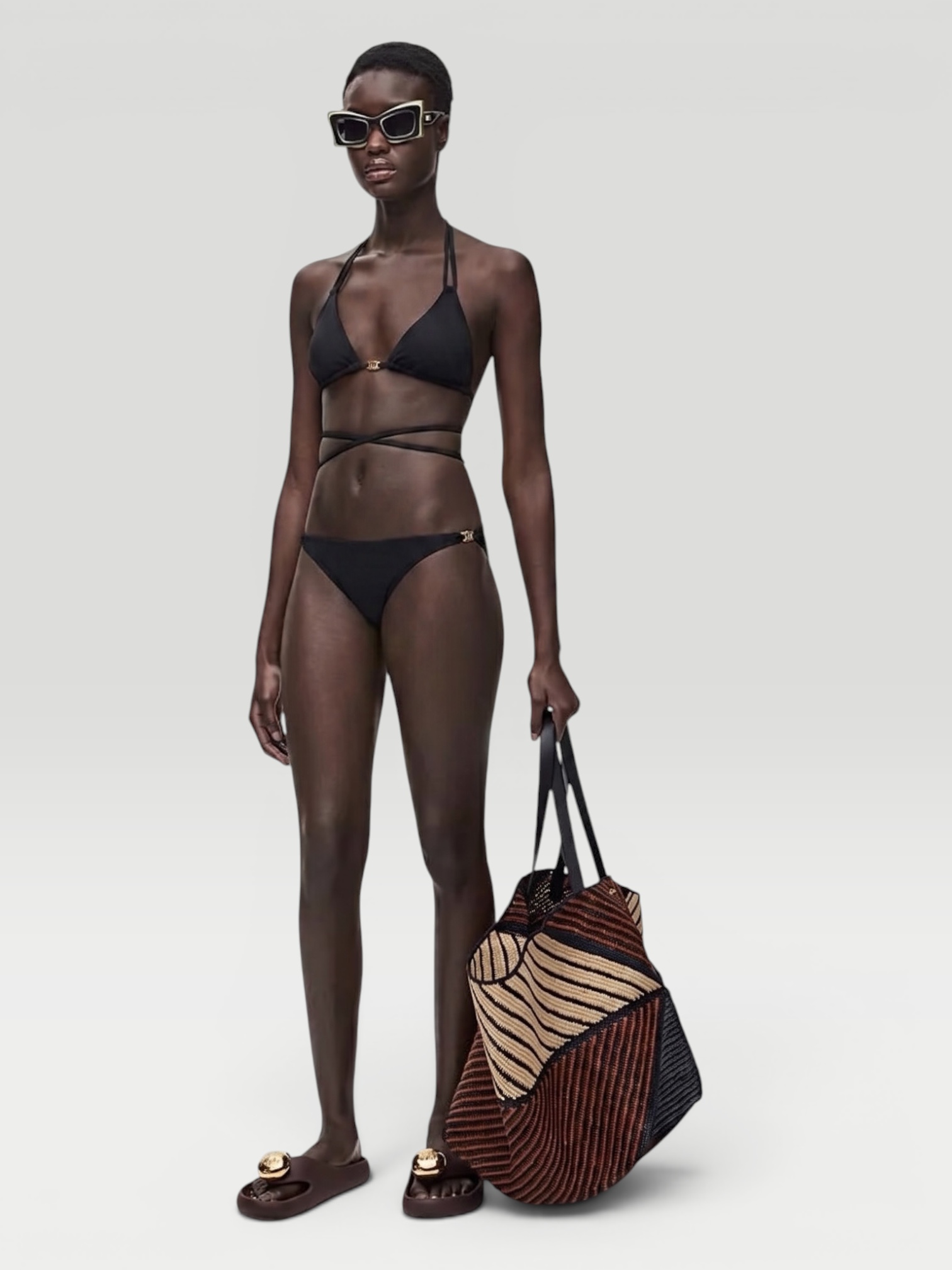 Loewe Paula's Ibiza Low-Rise Logo Bikini Bottom in ivory. Styled by Sharon Lombardo for FDV Concierge.