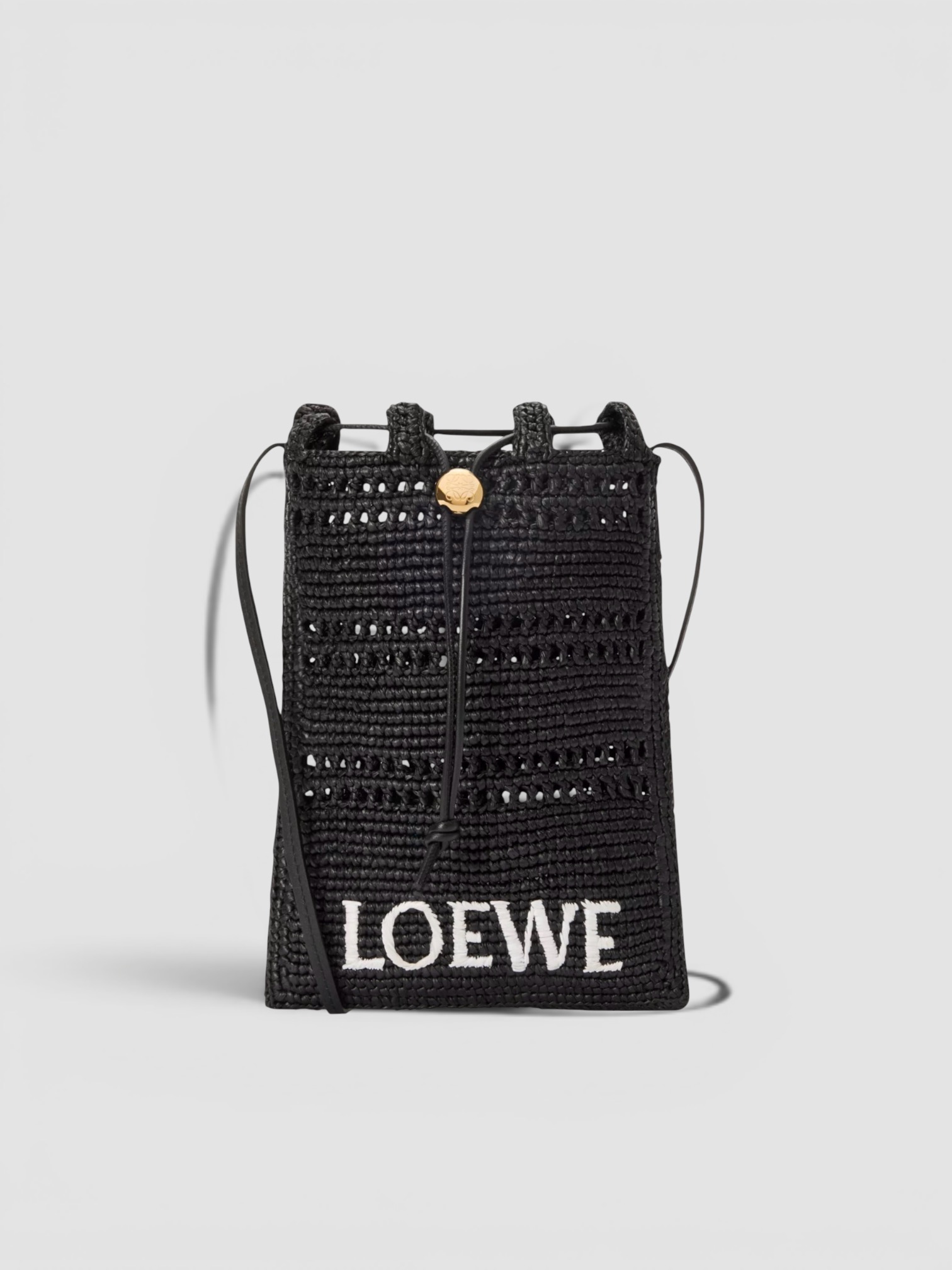 Loewe Paula's Ibiza Drawstring Pocket Raffia Cross-Body Bag in black, worn with FIL DE VIE Isadora Dress. Styled by Sharon Lombardo for FDV Concierge.