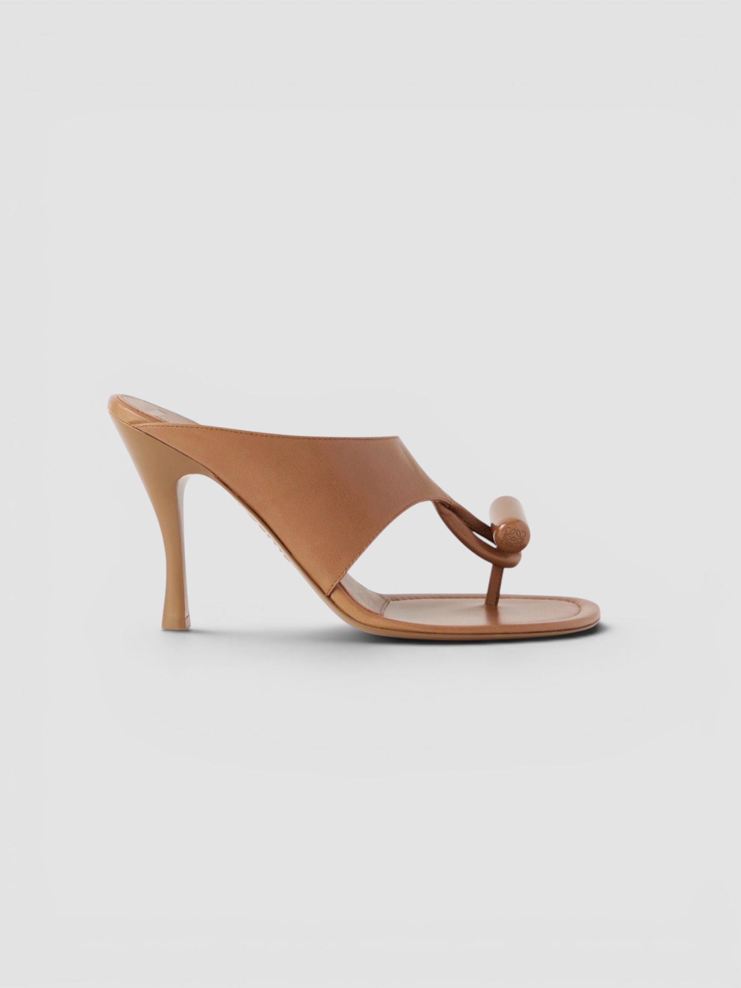Loewe Pebble Leather Thong Mules in tan.