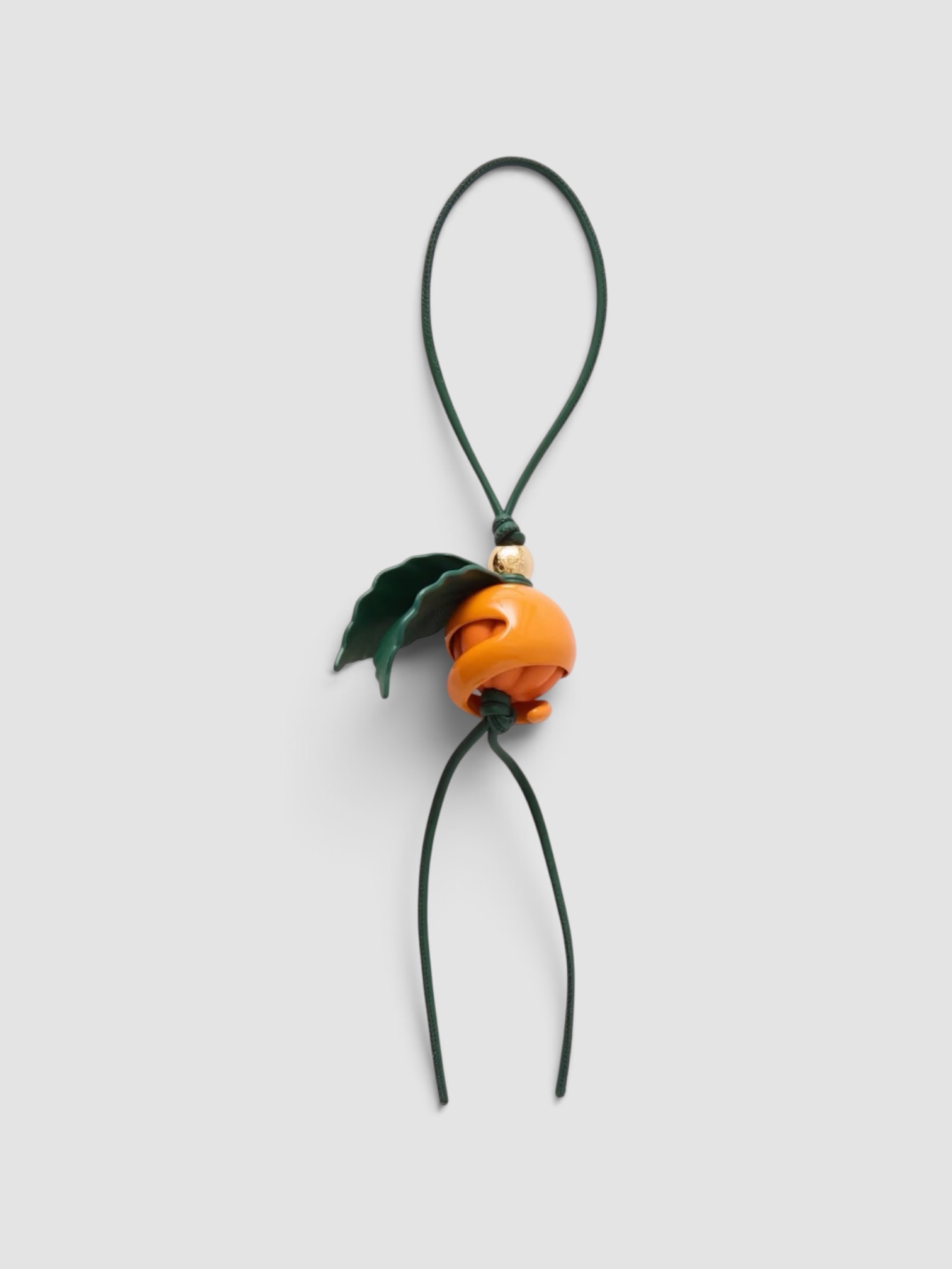 Loewe Peeling Orange Gold-Tone Leather Charm in orange.