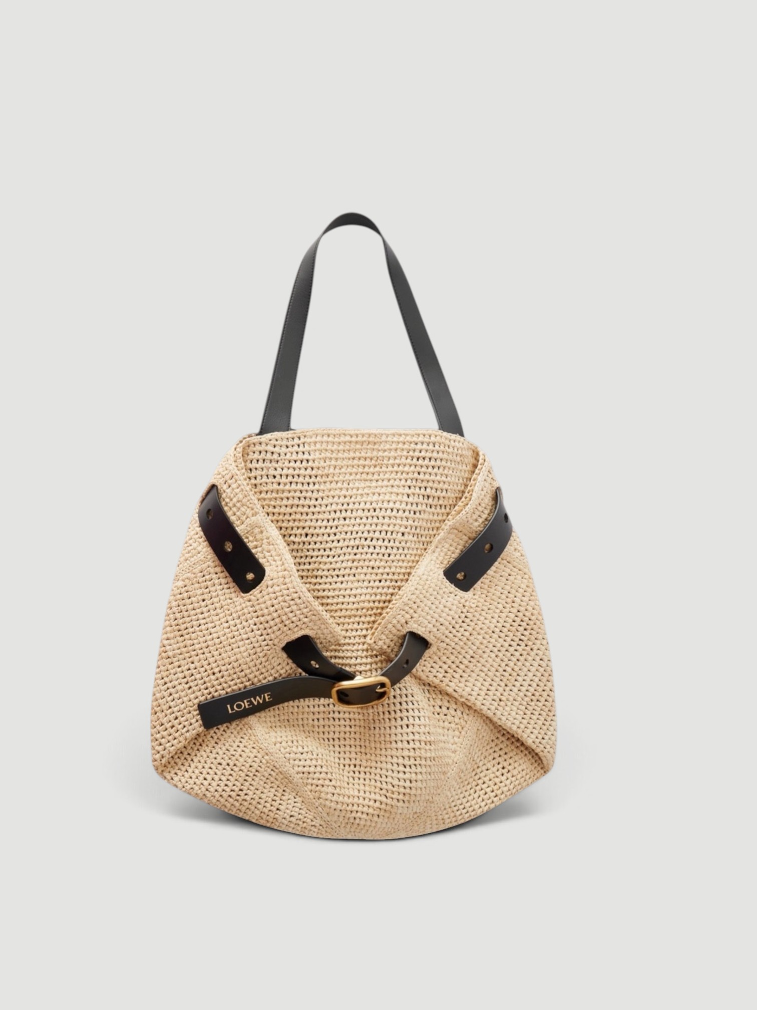 Loewe Leather-Trimmed Raffia Tote in natural, worn with Coperni One-Shoulder Logo-Plaque Swimsuit, Bottega Veneta Sampieri Flat Thong, Loro Piana Andre Linen Shirt, Arhaus Rivi Beach Towel, on the water. Styled by Sharon Lombardo for FDV Concierge.