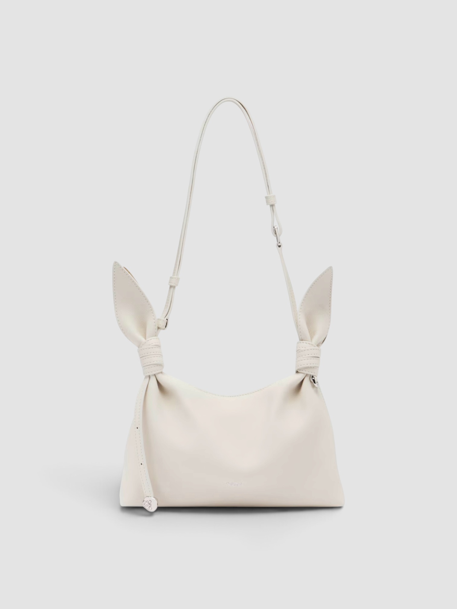 Loewe Scarf Mini Leather Shoulder Bag in white, worn with Totême Striped Shirtdress. Styled by Sharon Lombardo for FDV Concierge.