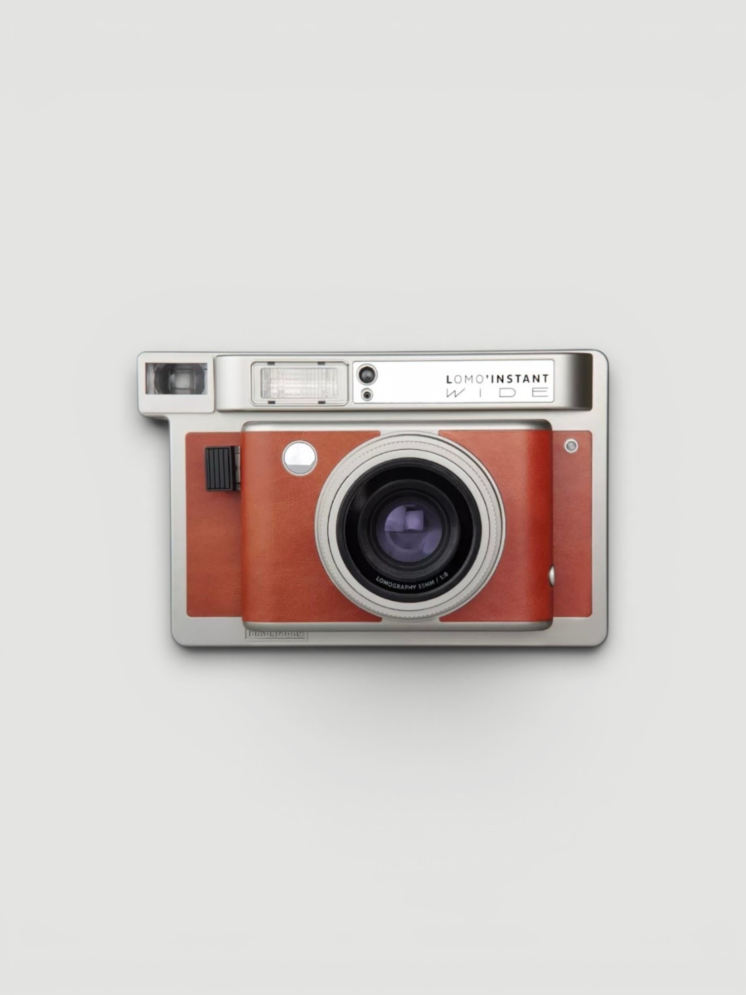 Lomography Lomo'Instant Wide Central Park Instant Camera with Lens Attachments in orange, worn with phoebe philo black tank top, Phoebe Philo Carpenter Shorts, Phoebe Philo Leather Fisherman Sandals, Phoebe Philo Small Stud Cabas Tote Bag, walking the city. Styled by Sharon Lombardo for FDV Concierge.