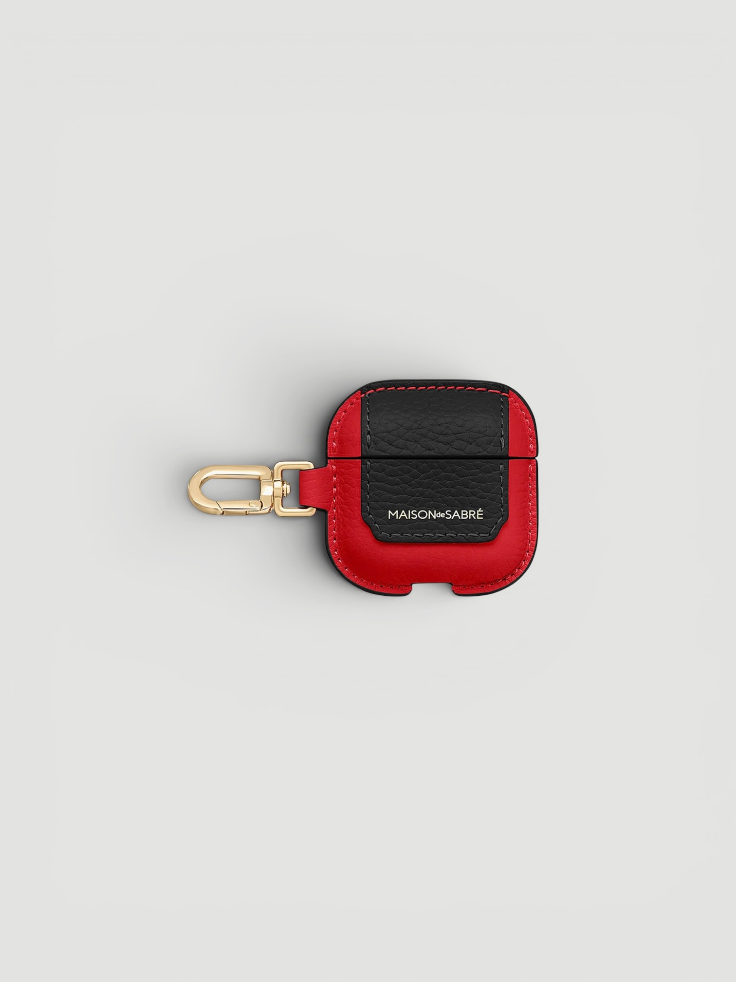 Maison de Sabré The AirPods 4 Case Charm in red.