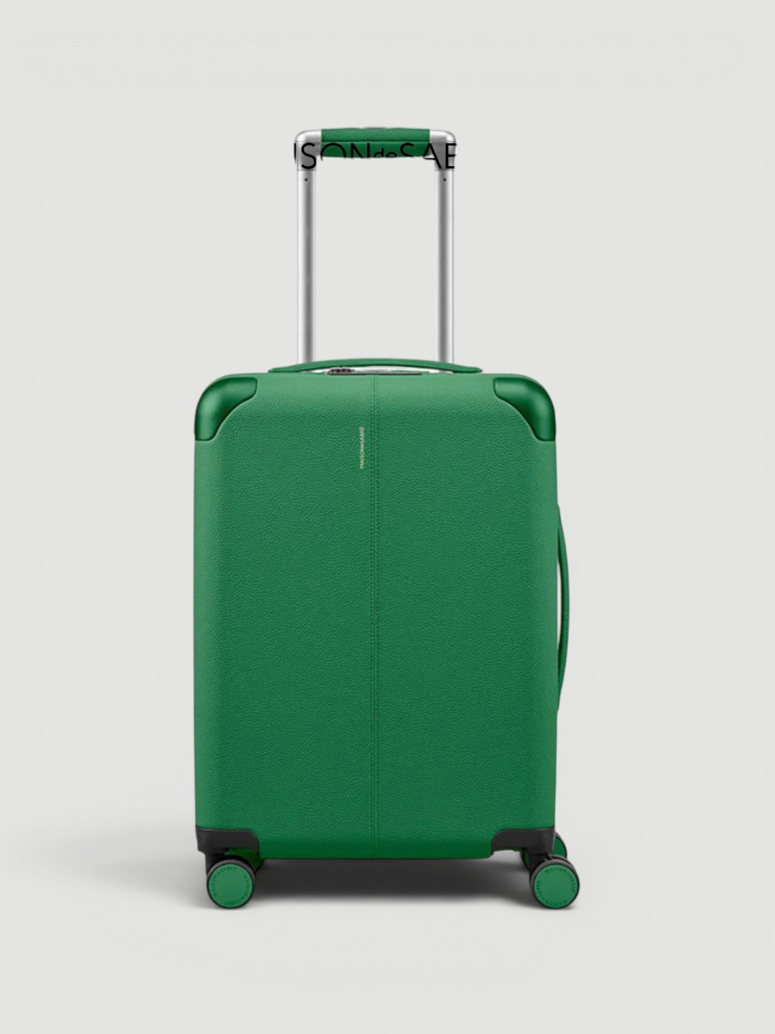 Maison de Sabré The Carry-On Suitcase in green.