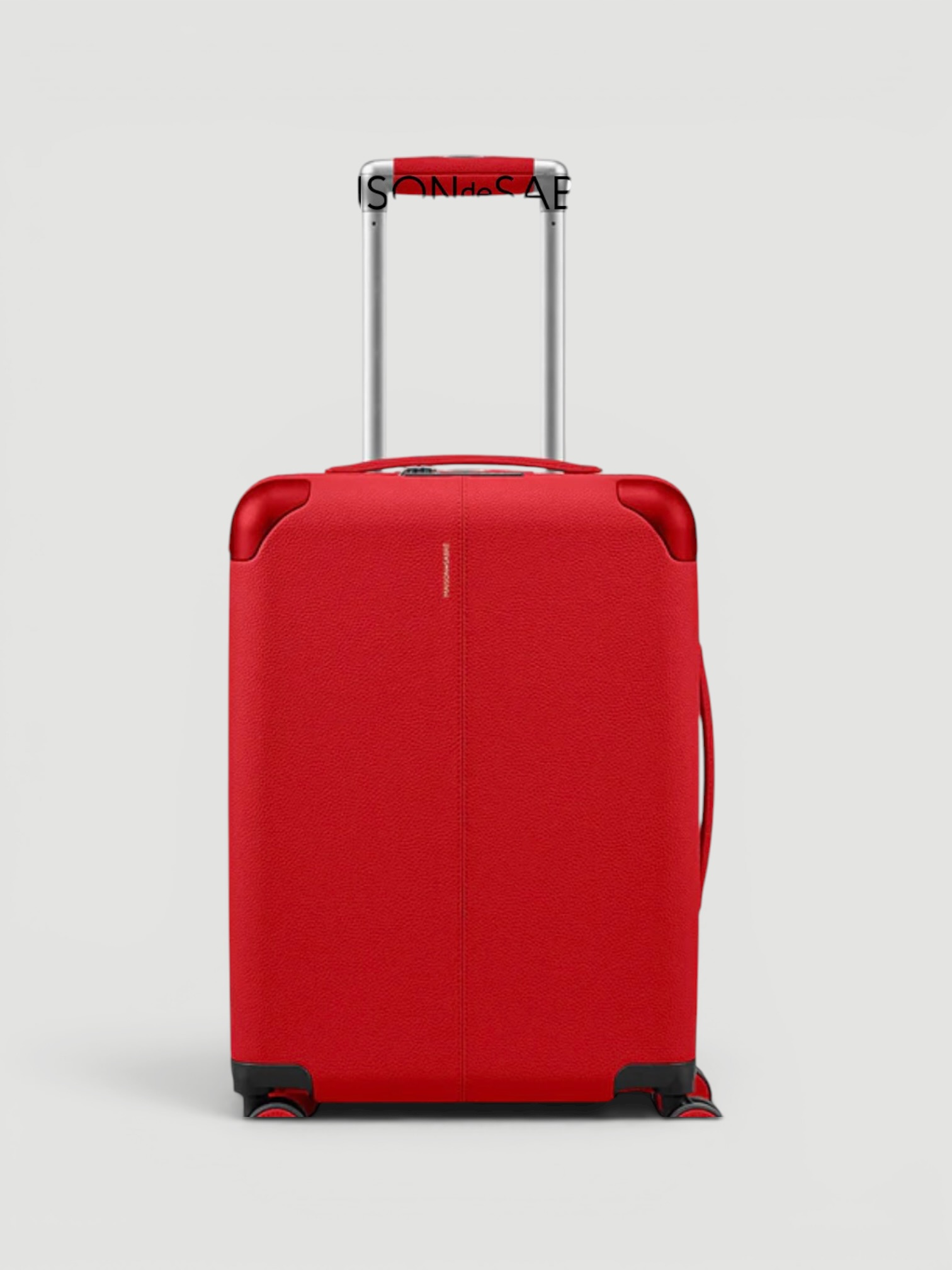 Maison de Sabré The Carry-On Suitcase in pomegranate red.