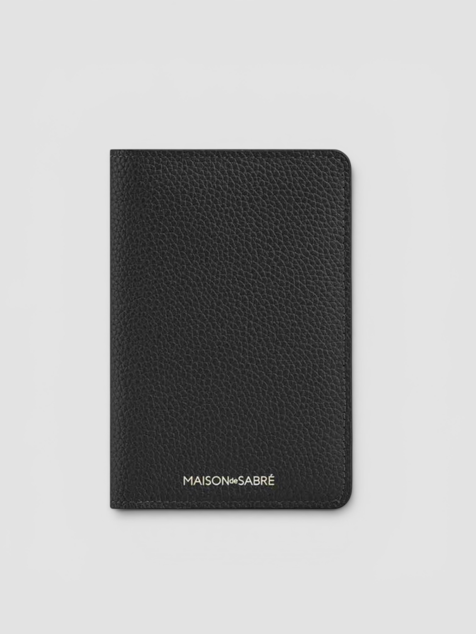 Maison de Sabré The Passport Holder in black caviar.