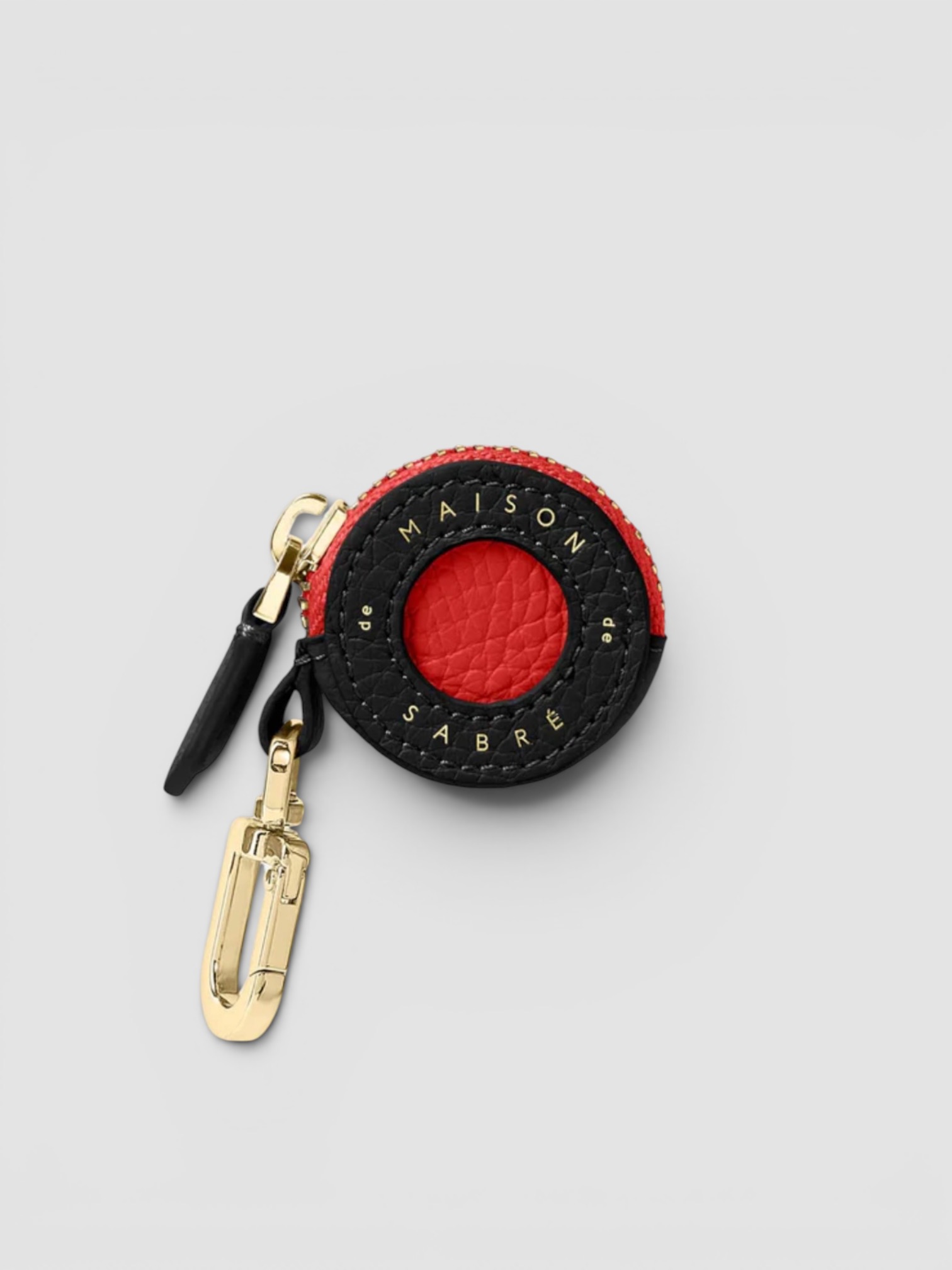 Maison de Sabré The Leather AirTag Charm in red.
