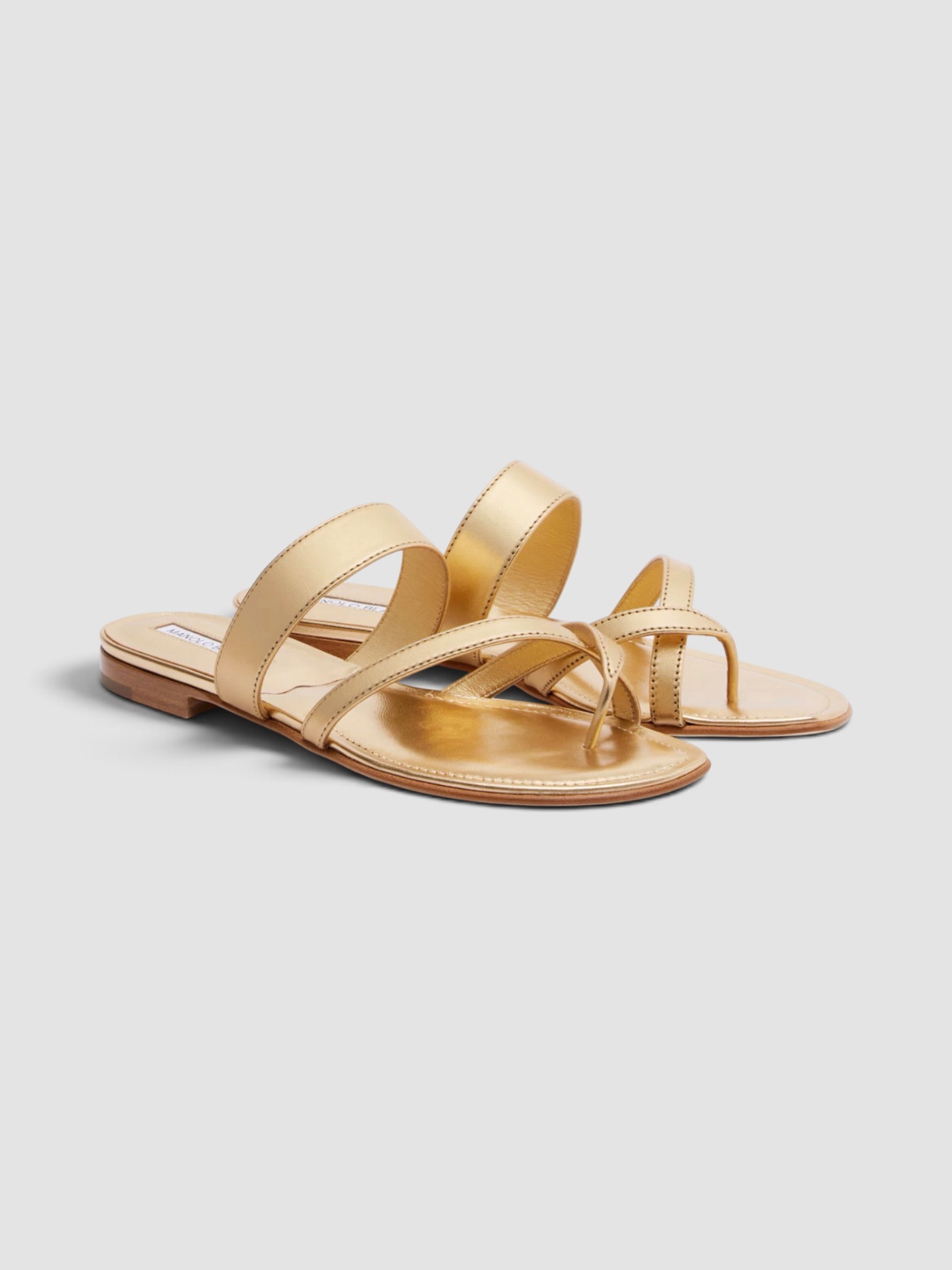Manolo Blahnik Susacru Leather Sandals in gold, worn with D'Ascoli Carpathia Silk Twill Belted Kaftan. Styled by Sharon Lombardo for FDV Concierge.