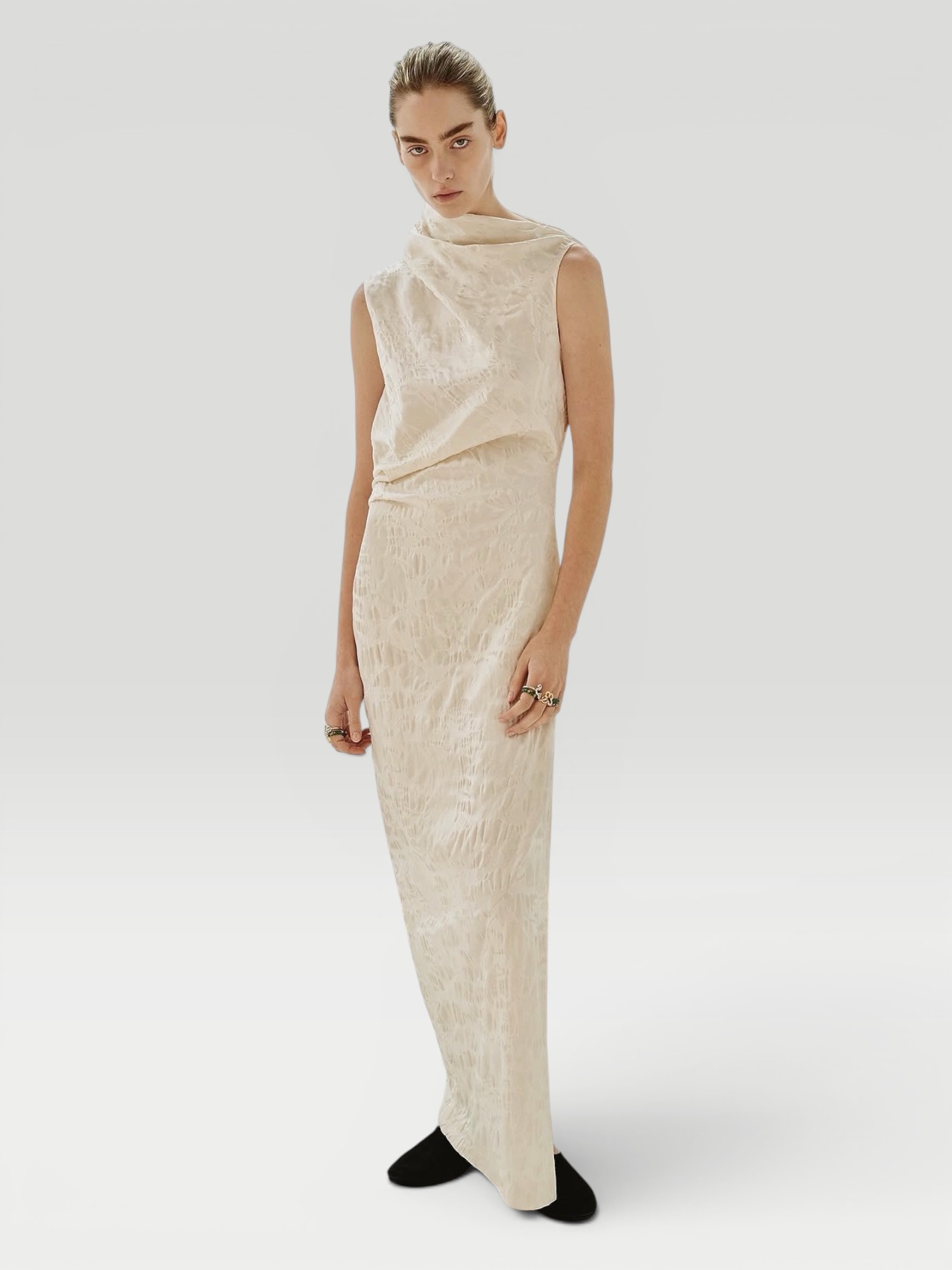 Marina Moscone Satin Jacquard Asymmetric Drape Column Dress in white, worn with Love Adorned Vintage Mixed Cut Diamond Signet Ring, Spinelli Kilcollin Aquarius Ring, Phoebe Philo Gathered Ballet Flat. Styled by Sharon Lombardo for FDV Concierge.