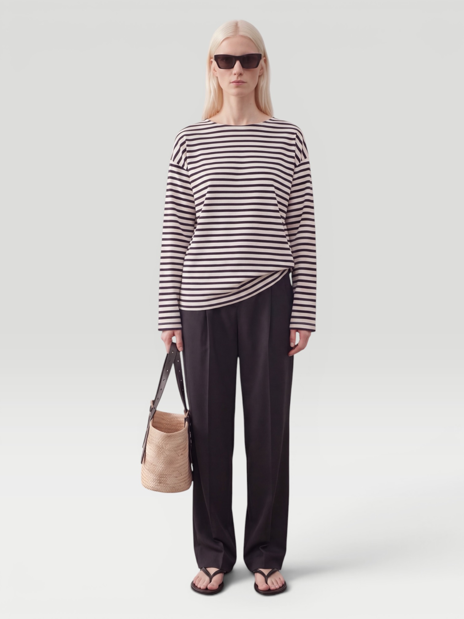 Matteau Breton Stripe Tee in navy/white, worn with Róhe Organza Lined Shorts, Phoebe Philo Peak Sunglasses, Bottega Veneta Pearl Necklace, Alaïa Heel Thong Mules in Velvet. Styled by Sharon Lombardo for FDV Concierge.