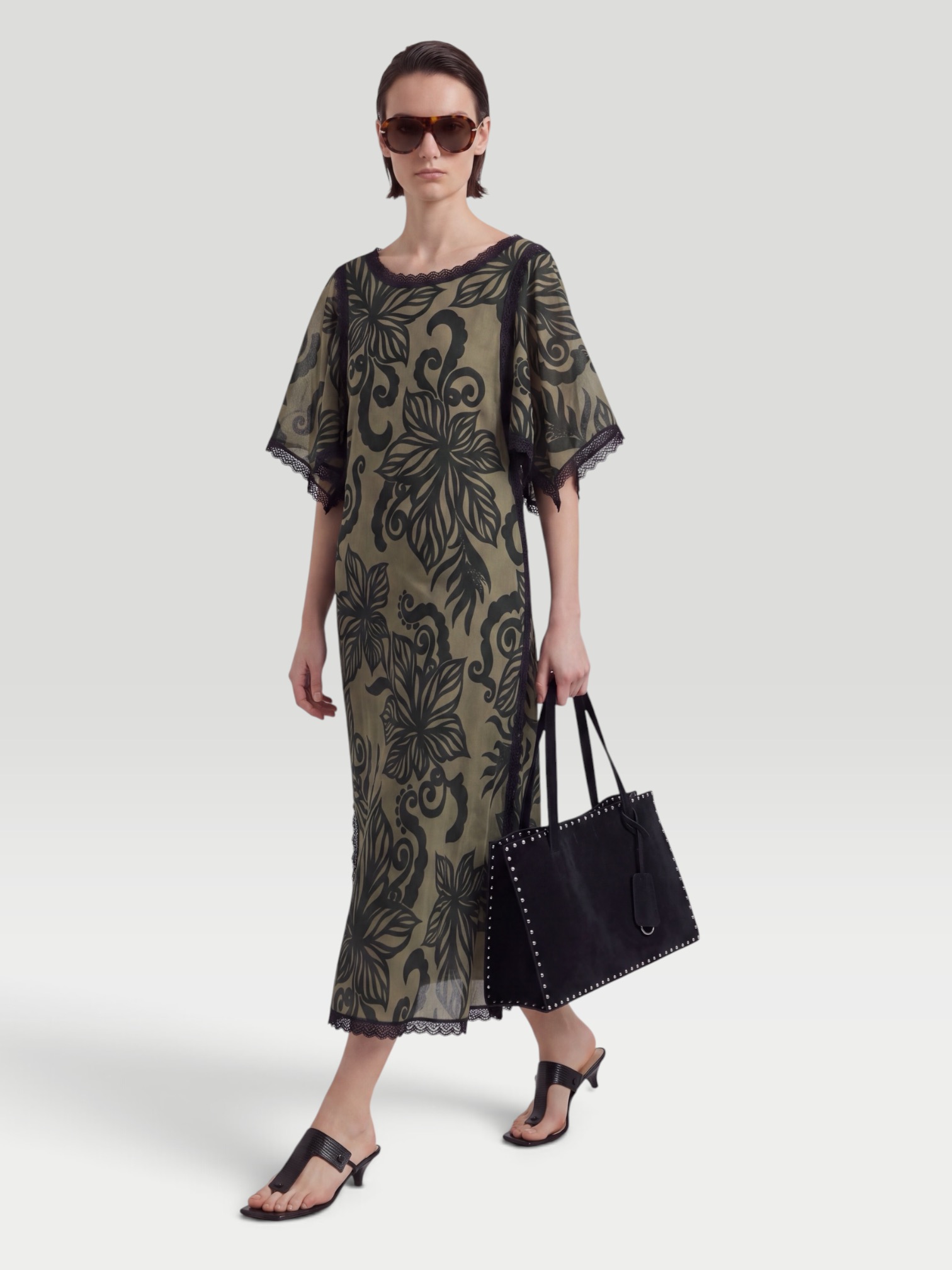 One Of Leandra Caftan in green, worn with Phoebe Philo Small Stud Cabas Tote Bag, Prada Patent Leather Thong Sandals, Bottega Veneta Cat-Eye Acetate Sunglasses, Chan Luu Caprice Crystal Toe Ring, the day. Styled by Sharon Lombardo for FDV Concierge.