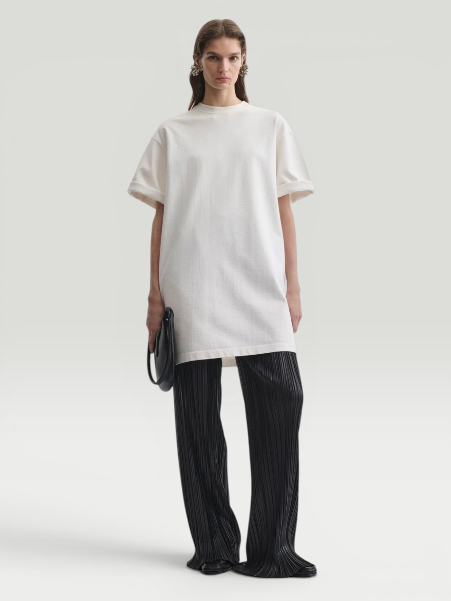 Phoebe Philo BIG T in white, worn with Phoebe Philo Fringed Trousers, Birkenstock Birkenstock Franca, Dries Van Noten Oval Sunglasses, Phoebe Philo Pot Cabas Suede Tote Bag, the day. Styled by Sharon Lombardo for FDV Concierge.