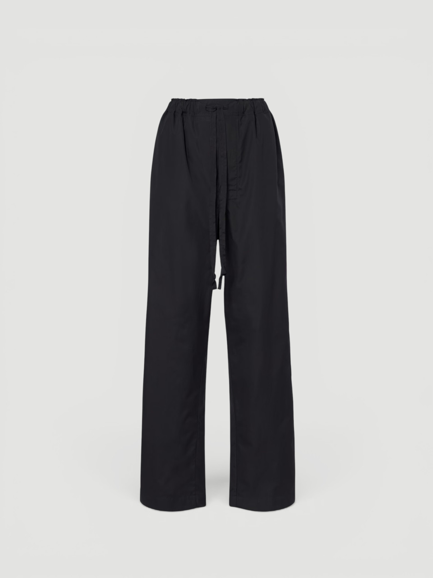 Phoebe Philo Cotton Wide-Leg Pants in black, worn with Phoebe Philo Striped Cotton-Jersey T-Shirt, Phoebe Philo Leather Fisherman Sandals. Styled by Sharon Lombardo for FDV Concierge.