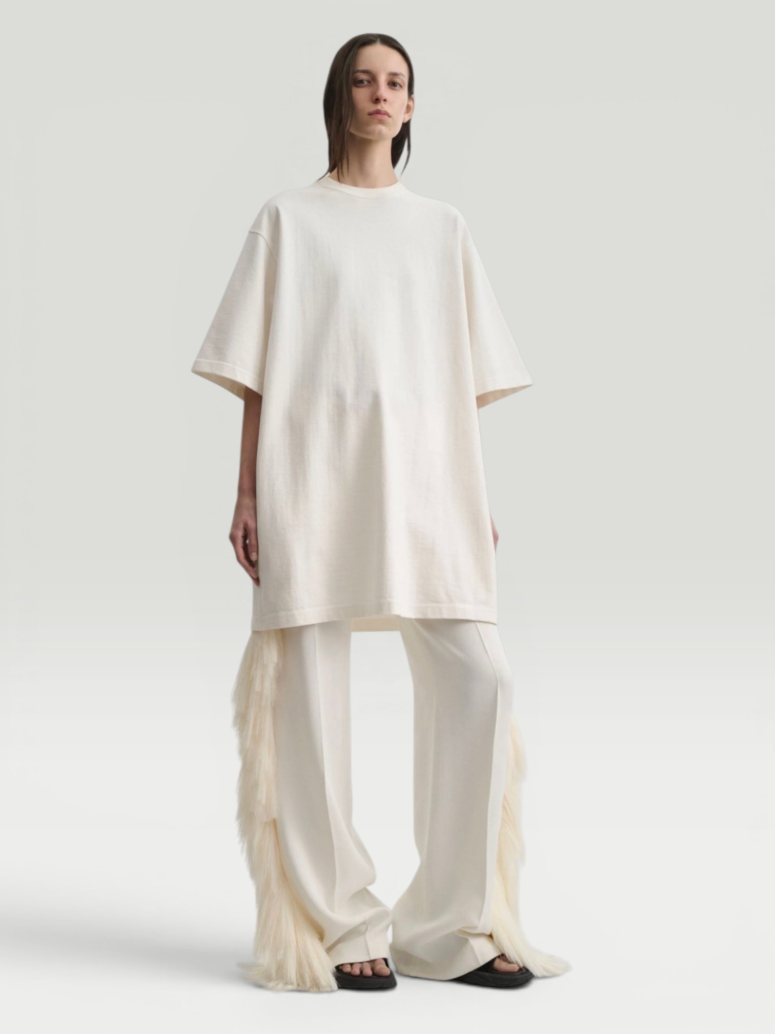 Phoebe Philo Fringed Trousers in vanilla, worn with Phoebe Philo BIG T, Birkenstock Birkenstock Franca, Dries Van Noten Oval Sunglasses, Phoebe Philo Pot Cabas Suede Tote Bag, the day. Styled by Sharon Lombardo for FDV Concierge.