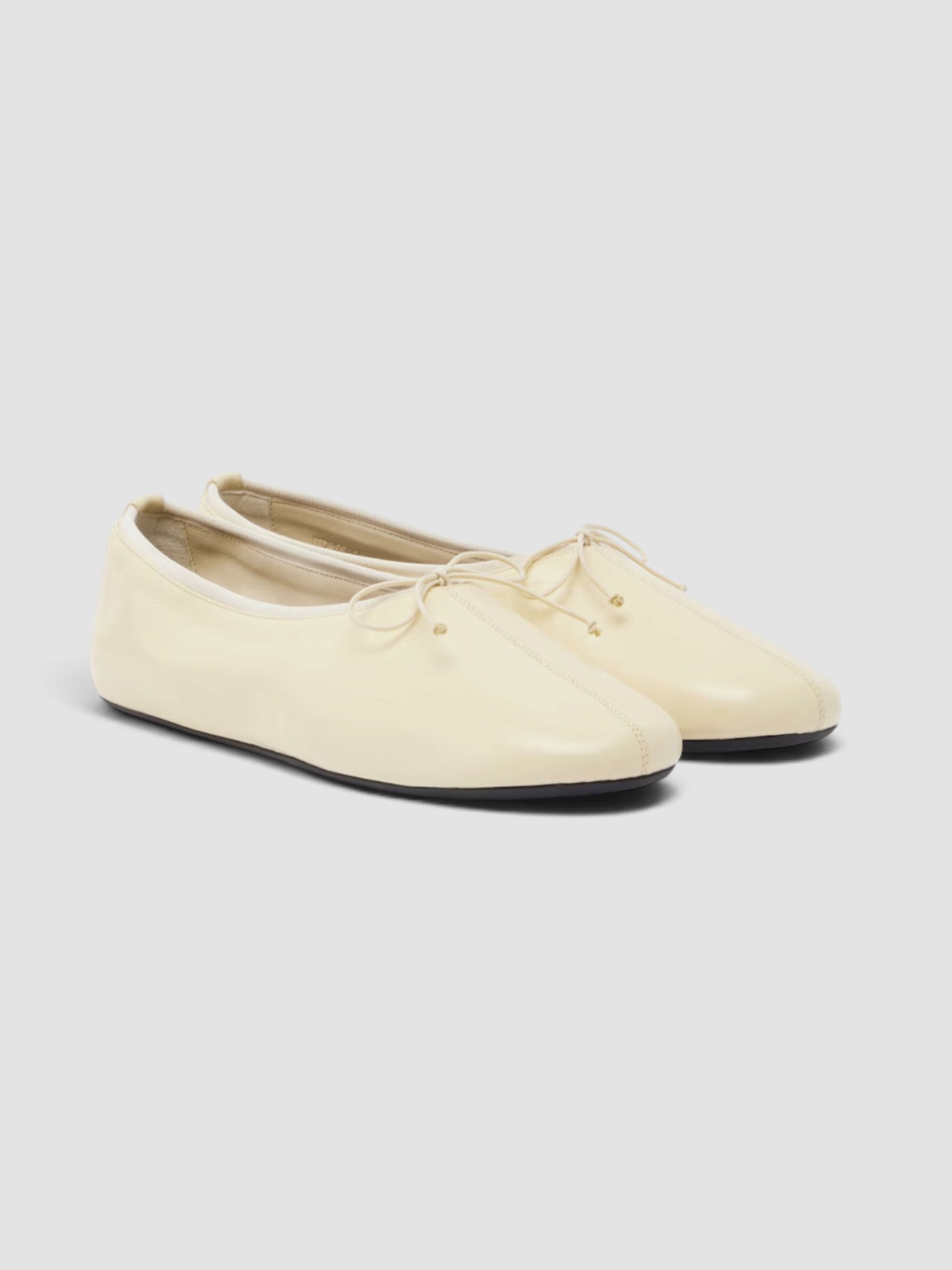 Phoebe Philo Gathered Leather Ballet Flats in white.