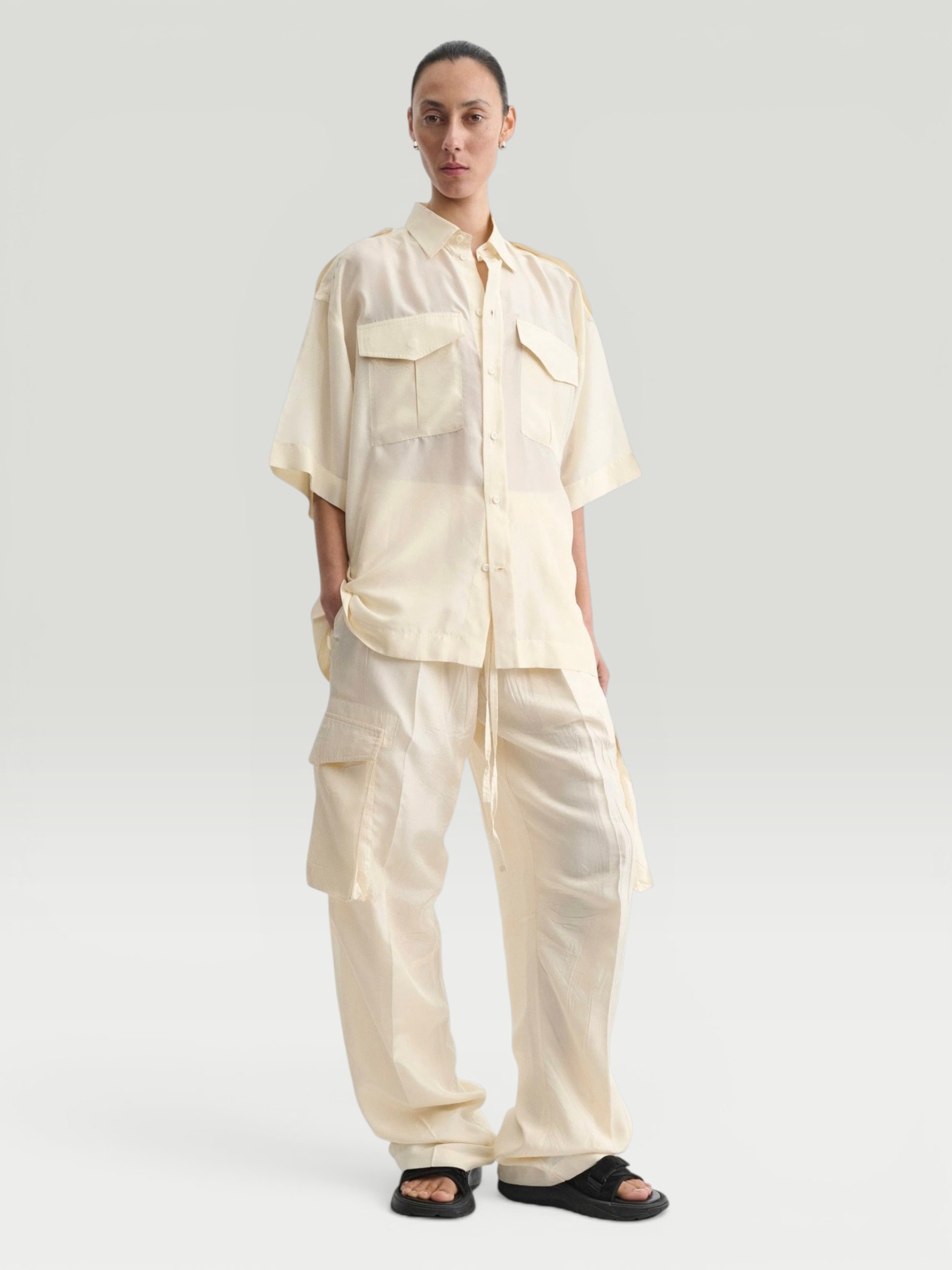 Phoebe Philo Silk Cargo Pants in vanilla, worn with Phoebe Philo Silk Shirt, Phoebe Philo Suede Sandals, Phoebe Philo Gold Studded Hoops. Styled by Sharon Lombardo for FDV Concierge.