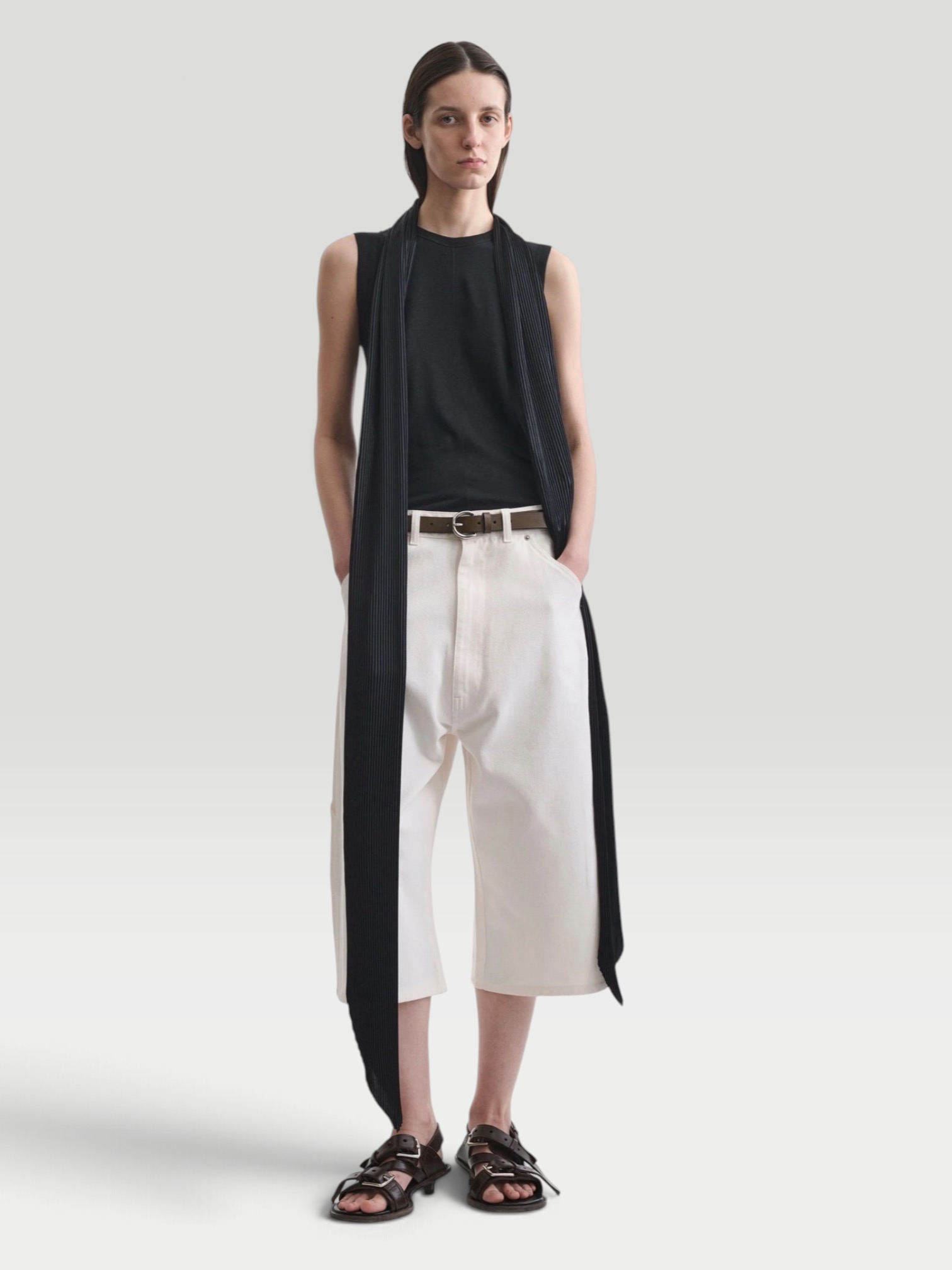 Phoebe Philo Carpenter Shorts in white, worn with phoebe philo black tank top, Phoebe Philo Leather Fisherman Sandals, Phoebe Philo Small Stud Cabas Tote Bag, Phoebe Philo Cruise Sunglasses, walking the city. Styled by Sharon Lombardo for FDV Concierge.