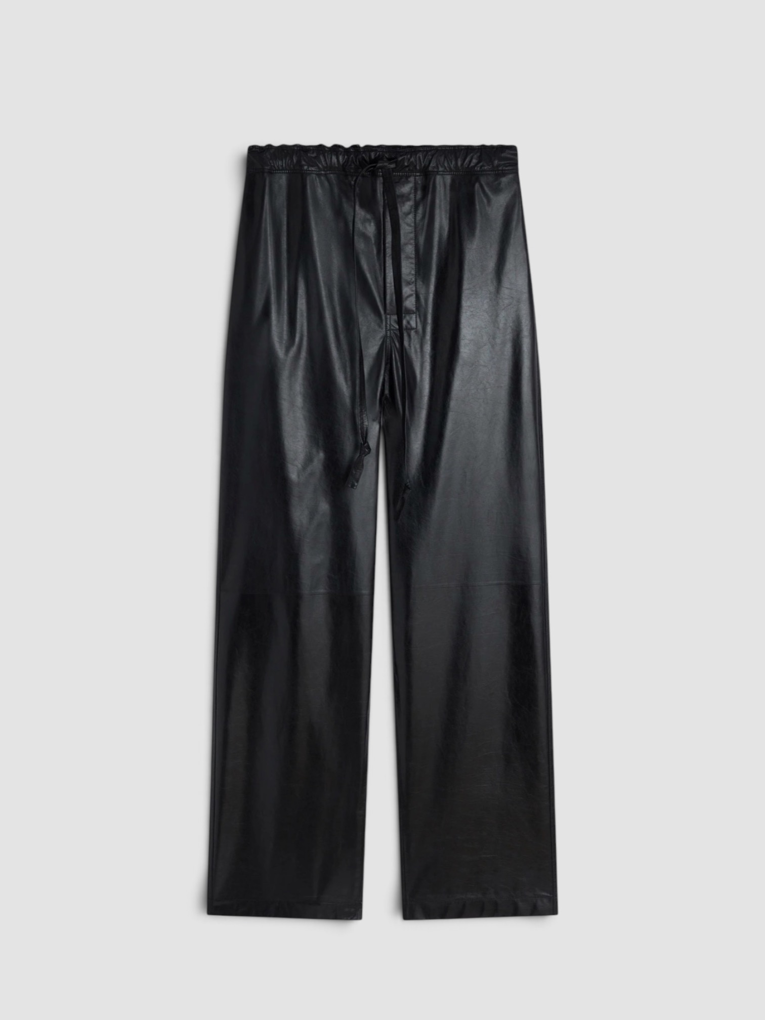 Phoebe Philo Leather Wide-Leg Pants in black, worn with Phoebe Philo Striped Cotton-Jersey T-Shirt. Styled by Sharon Lombardo for FDV Concierge.