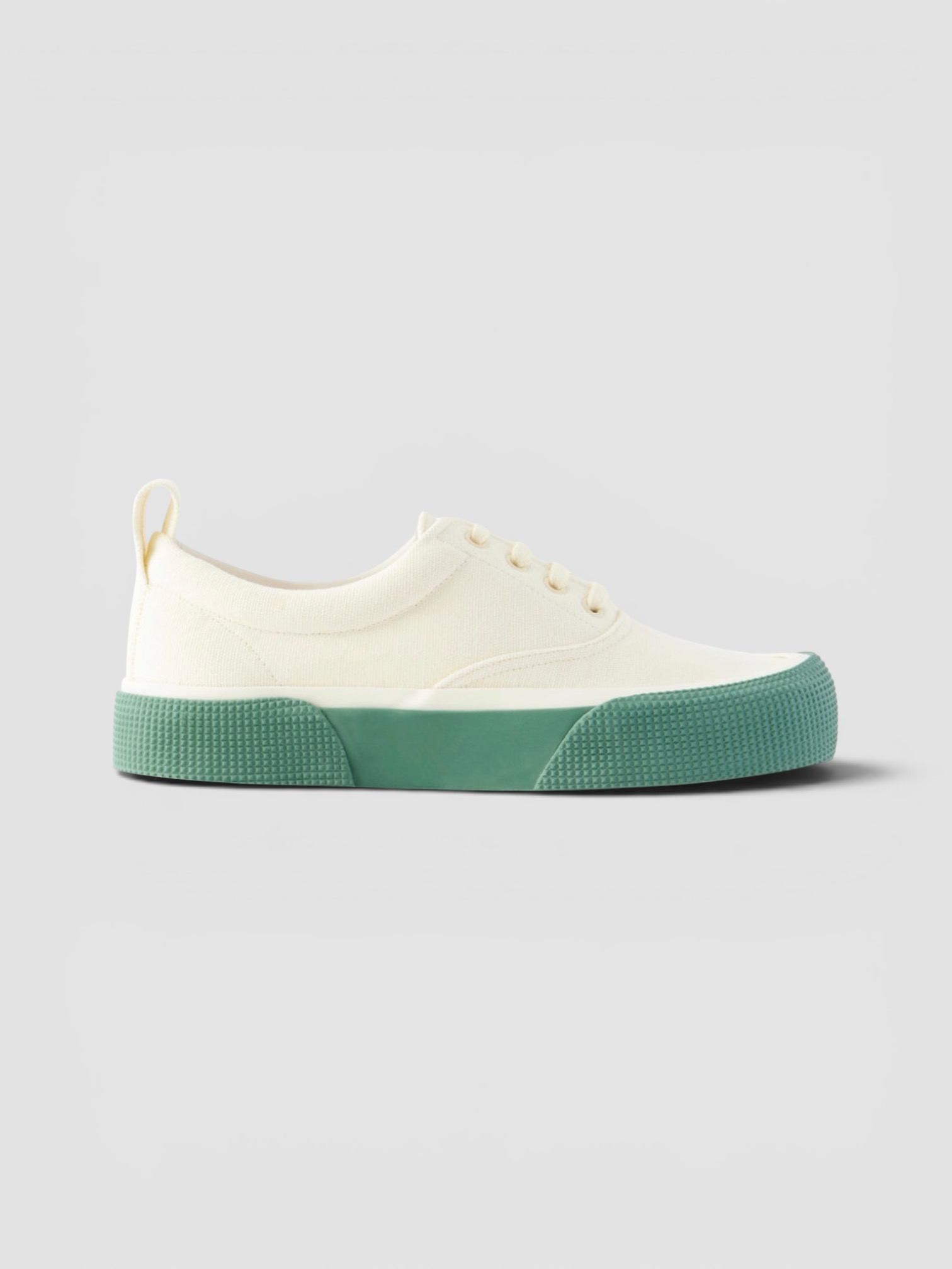 Phoebe Philo Plimsole Canvas Sneakers in cream.