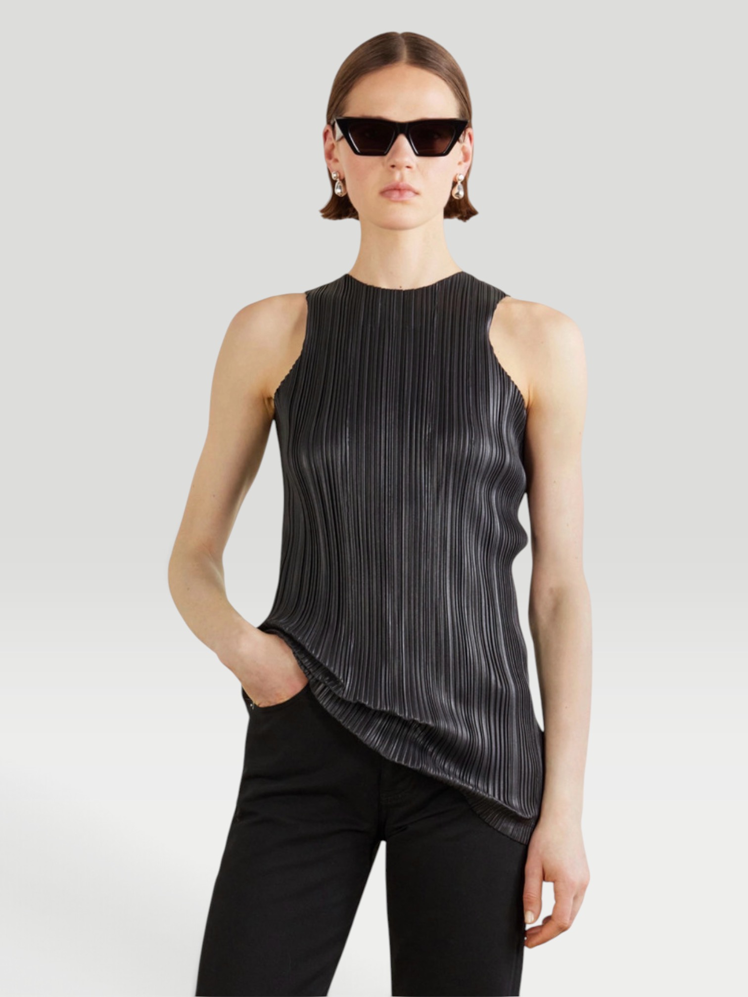 Phoebe Philo Razor Pleated Tank in black, worn with Phoebe Philo Razor Pleated Straight-Leg Pants. Styled by Sharon Lombardo for FDV Concierge.