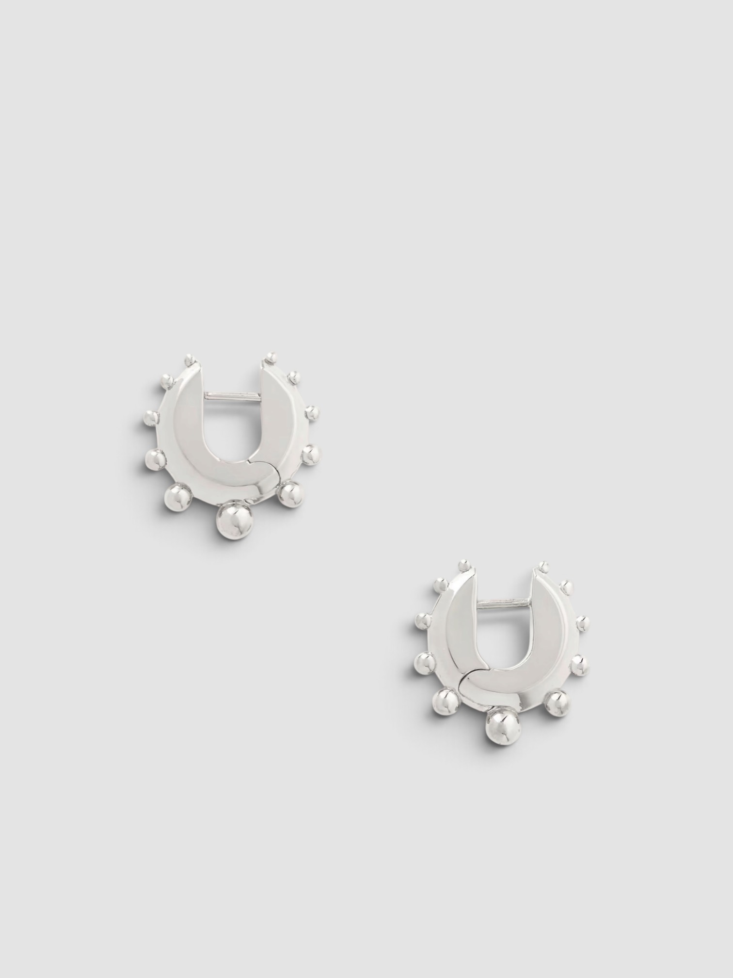 Phoebe Philo Sterling Silver Hoop Earrings in silver.