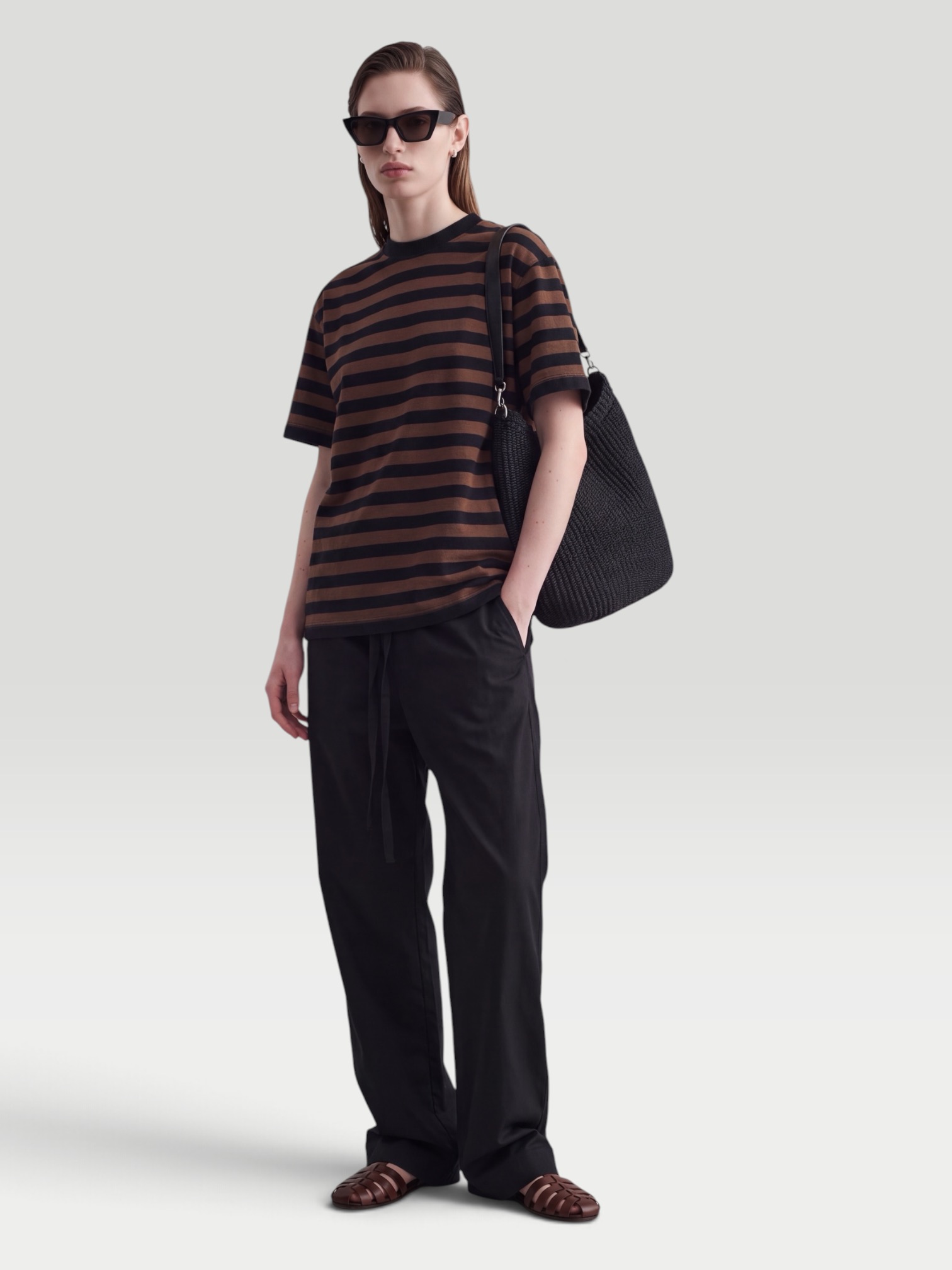 Phoebe Philo Striped Cotton-Jersey T-Shirt in brown/black, worn with Phoebe Philo Leather Wide-Leg Pants. Styled by Sharon Lombardo for FDV Concierge.