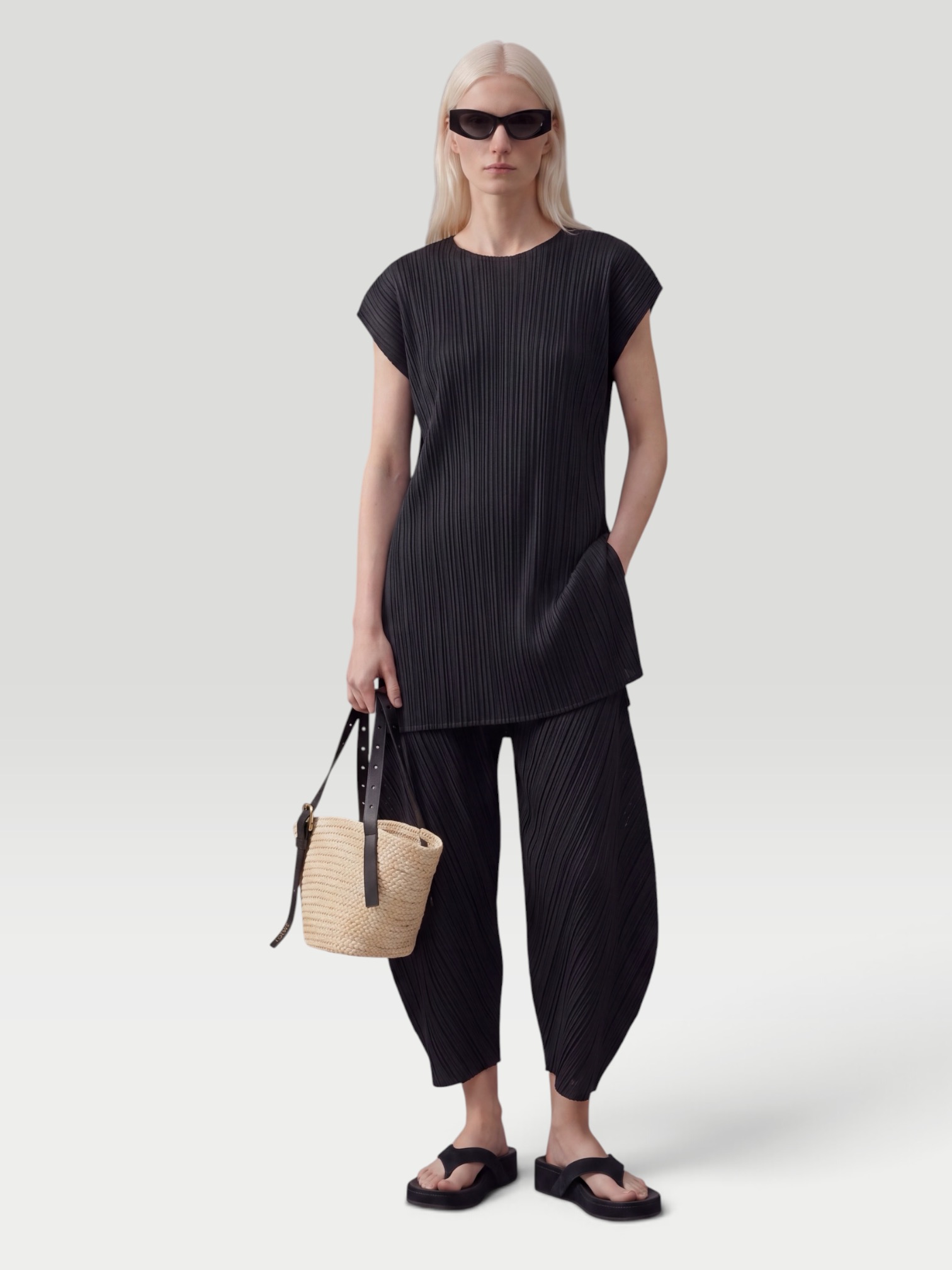 Pleats Please Issey Miyake Monthly Colors: July Pleated Barrel-Leg Pants in black. Styled by Sharon Lombardo for FDV Concierge.