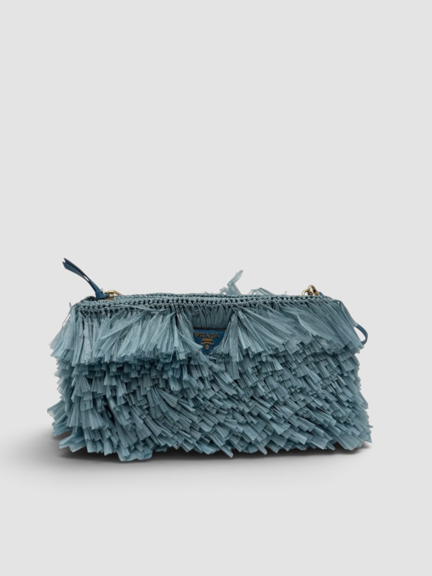 Prada Blue Fringed Clutch in blue, worn with D'Ascoli Carpathia Silk Twill Belted Kaftan, Manolo Blahnik Susacru Leather Sandals, Dries Van Noten Oval Sunglasses, Phoebe Philo Gold Studded Hoops, walking the city. Styled by Sharon Lombardo for FDV Concierge.