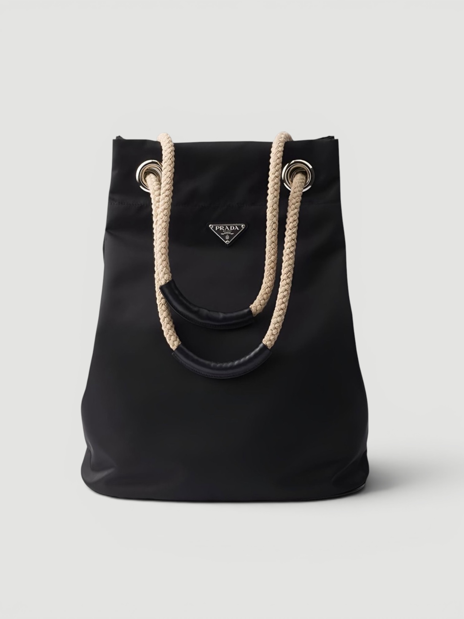 Prada Re-Nylon Small Mariner Drawstring Tote Bag in black, worn with St. Agni Relaxed Tee Dress. Styled by Sharon Lombardo for FDV Concierge.