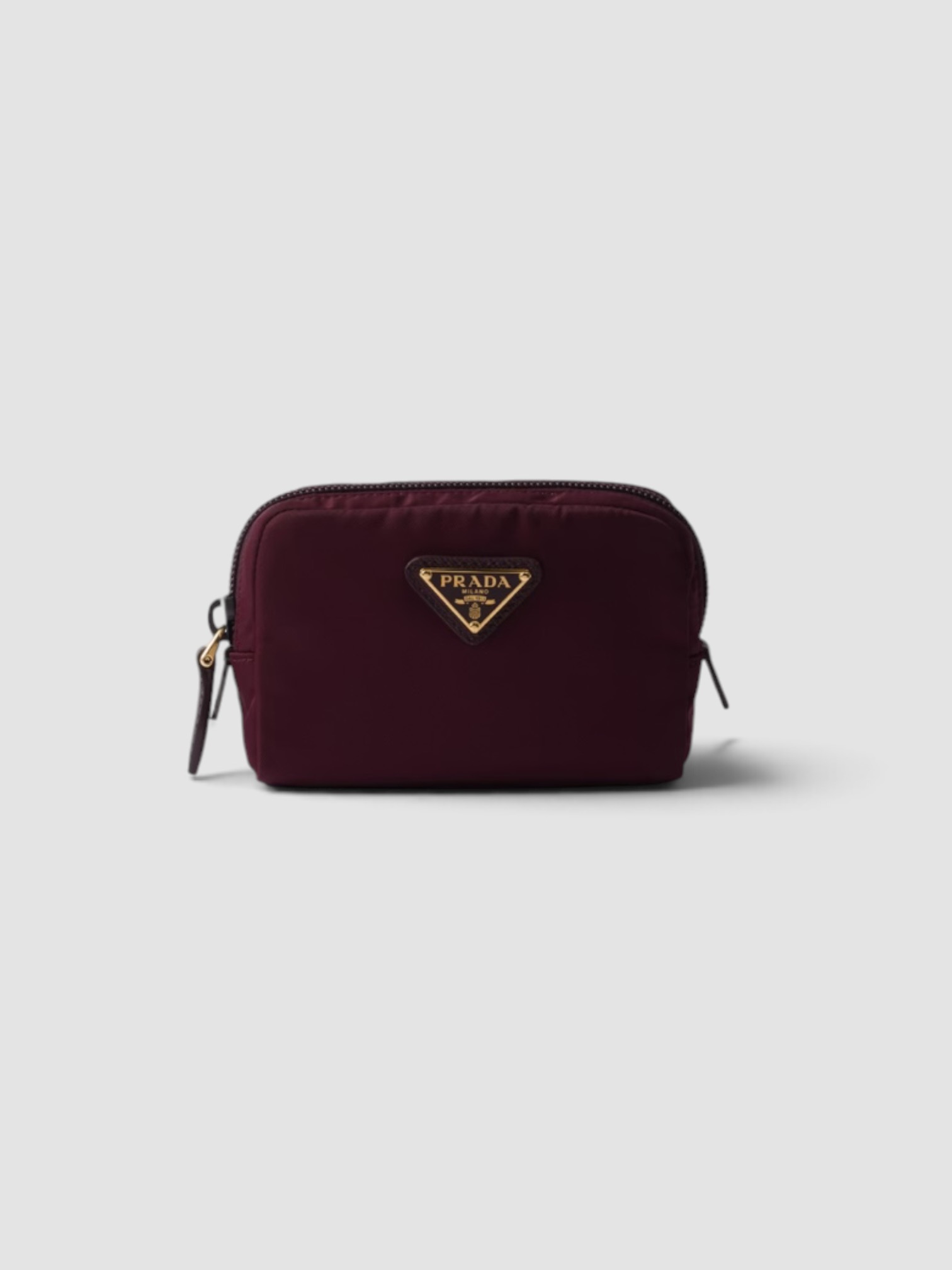 Prada Micro Re-Nylon Pouch in burgundy.